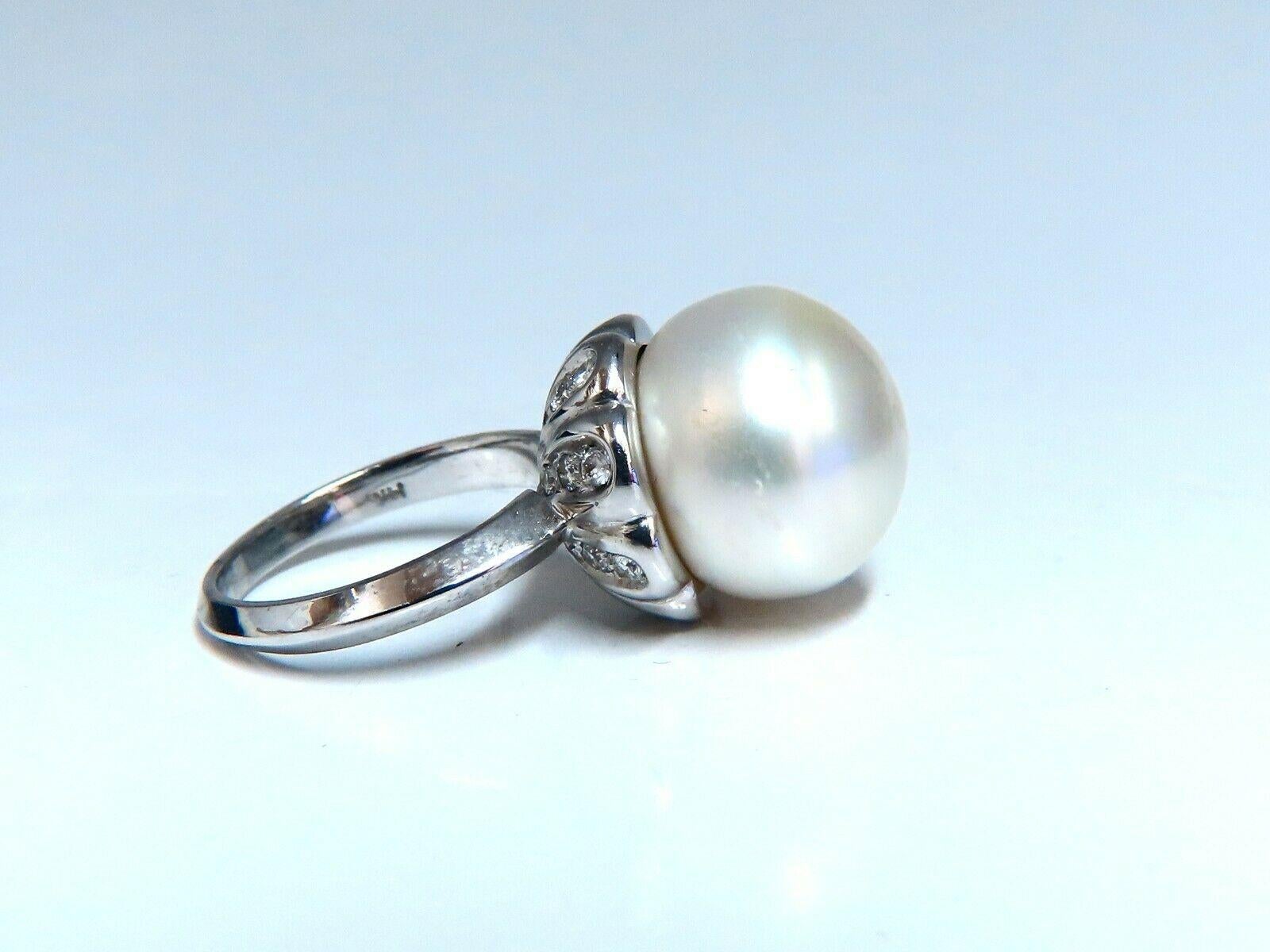15.5mm Natural South Seas White Pearl Ring

Silver overtone

Side diamonds: .40ct G-color Vs-2 clarity.

14kt. white  gold

11.9 grams.

Current ring size: 8

We may resize.

Depth of ring: 18.5mm