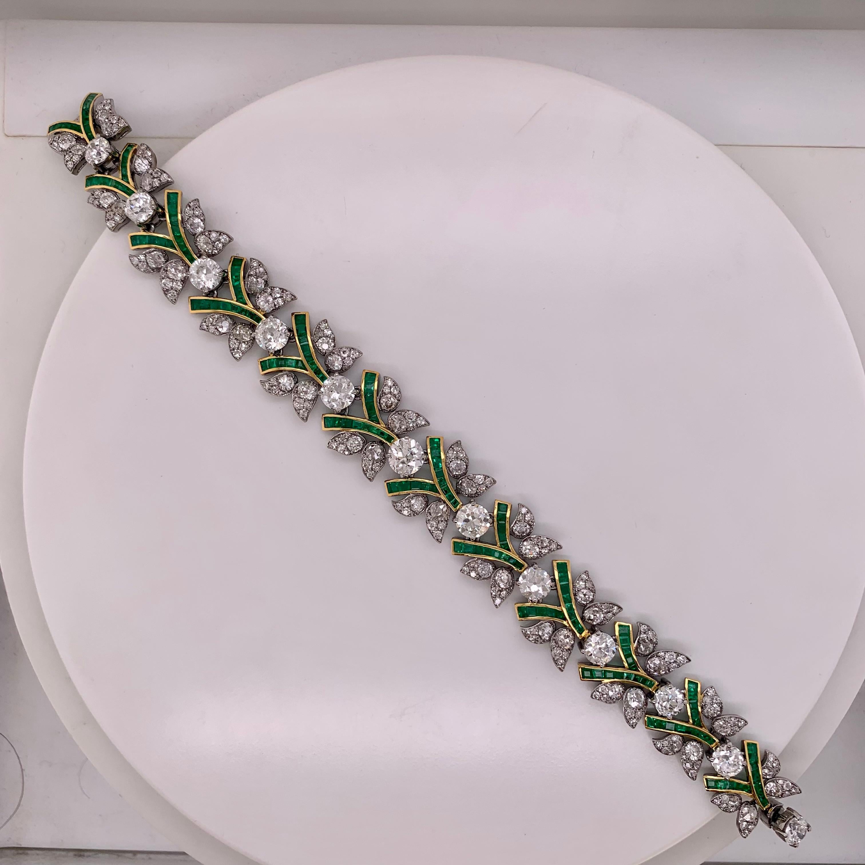 This bracelet is adorned with 15.52 carats of diamonds which feature a combination of single cut and old cut.

Surrounded by 2.85 carats of square cut emeralds, it provides a contrast that enhances the diamonds’ radiance. 

Crafted in 18k gold with