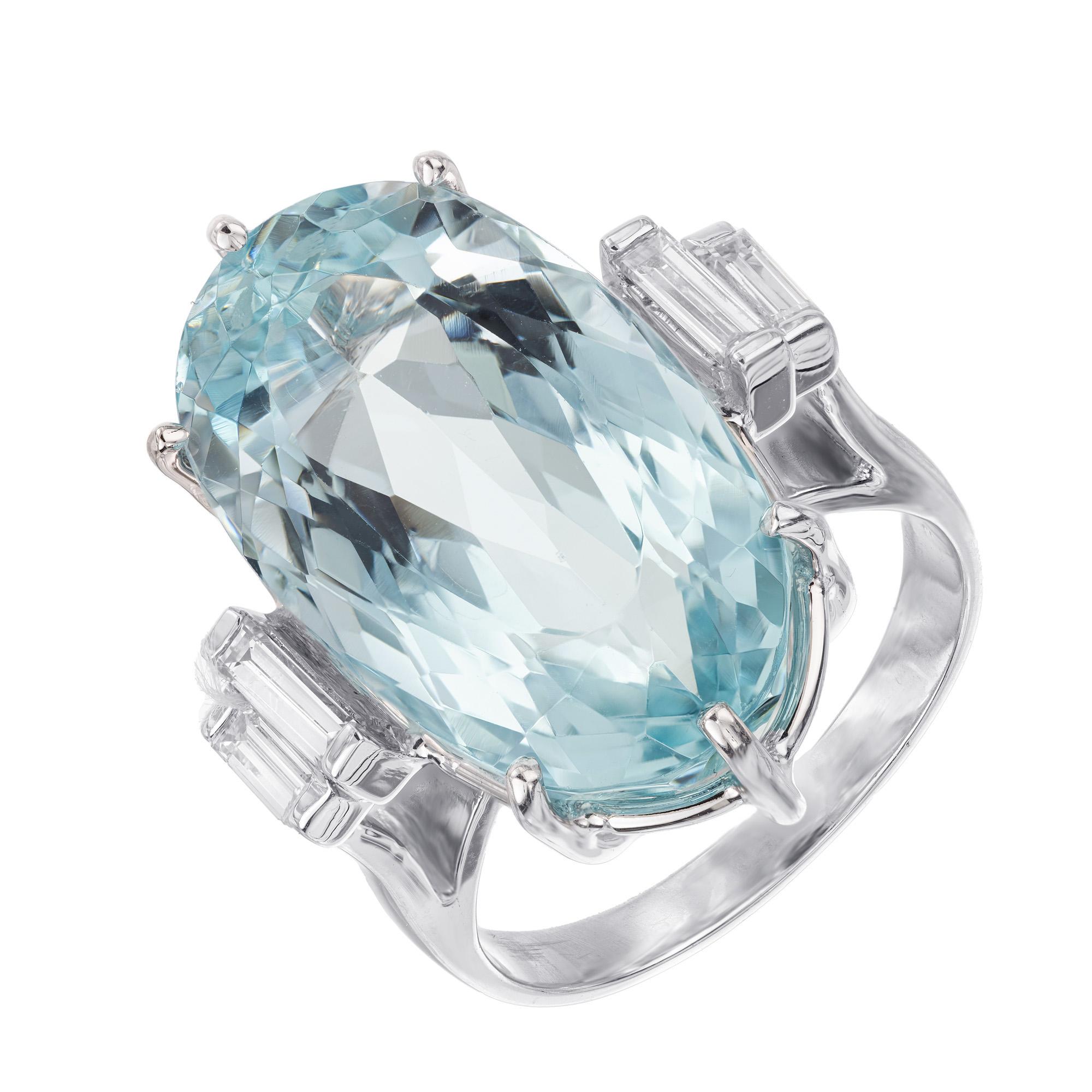 Spectacular elongated natural oval aquamarine and diamond cocktail ring. Classic vintage mid century 1960's 15.52ct aqua, accented by 2 straight baguettes on each side of the stone. Mounted in a 14k white gold setting, the aquamarine centerpiece