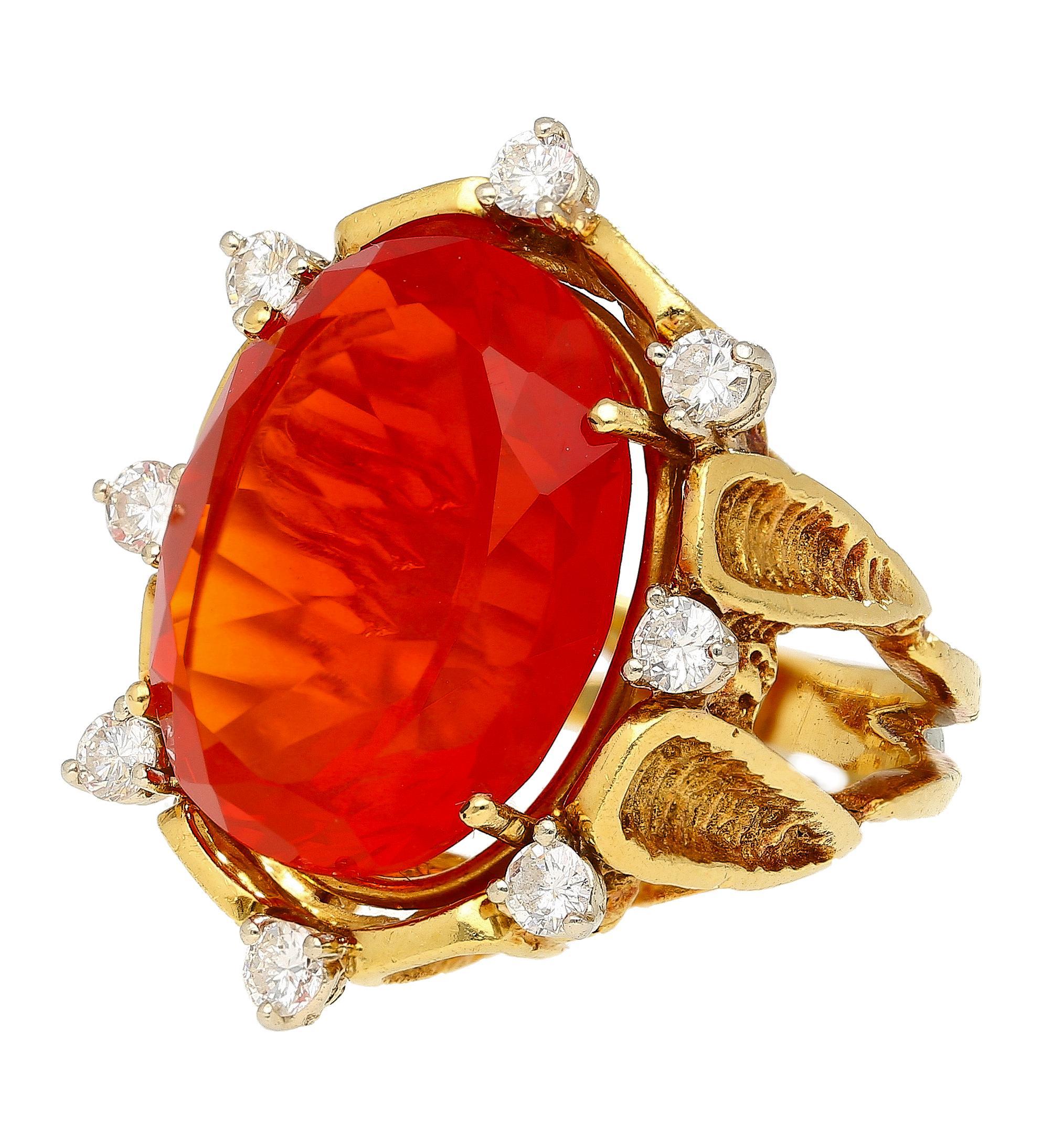 Express your bold and fiery style with this 15.53 carat vintage Mexican opal ring. The vibrant center stone features a round cut and prong set on an 18K gold splint shank band. Its brilliant orange hue exudes confidence and luxurious taste.