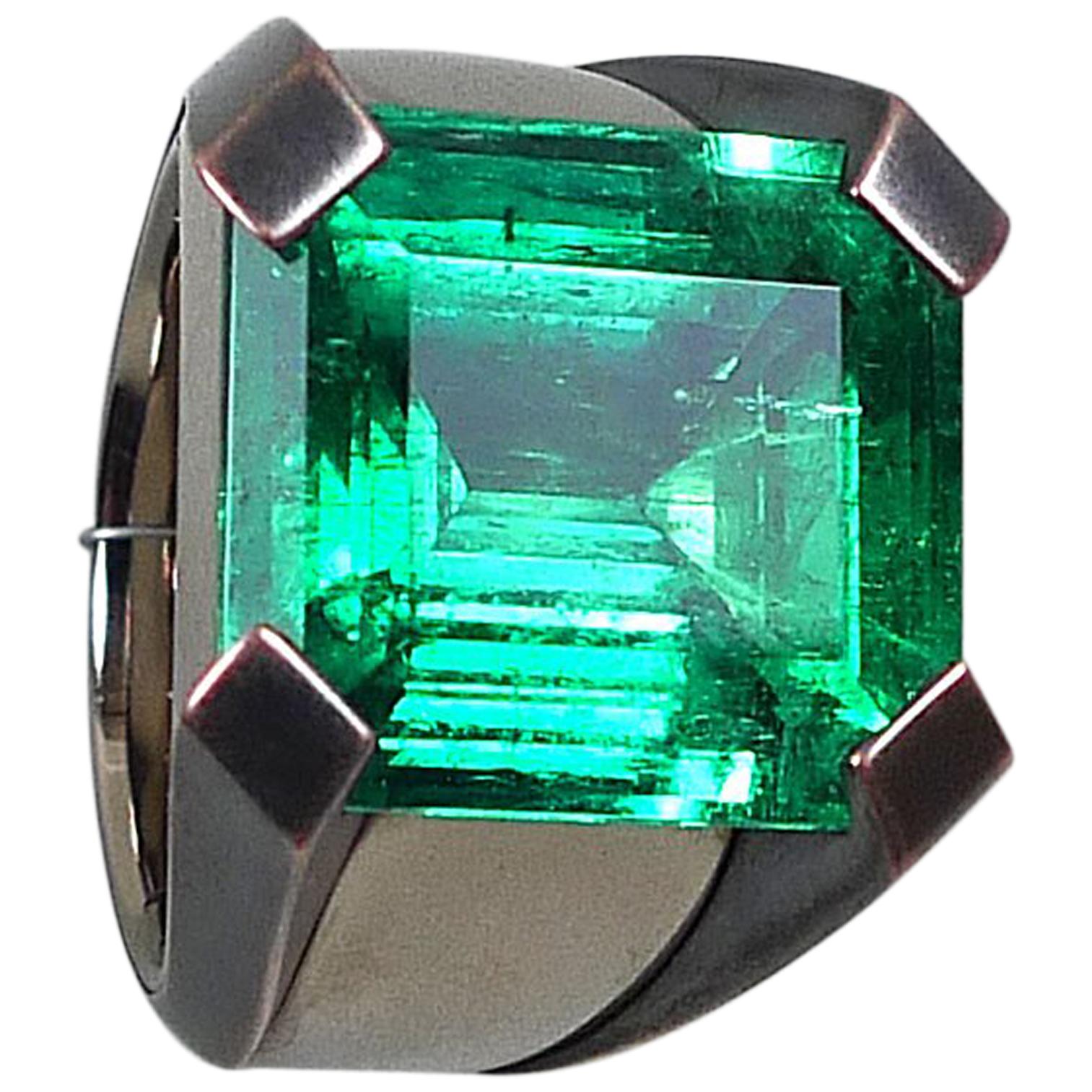 POWER SUPPLY is my name. Stunning designed extraordinary Colombian emerald ring, handcrafted in solid 18 karat white gold with powerful bronze prongs. Showcasing a top of his class quality perfect cutted natural Colombian emerald (coming from the