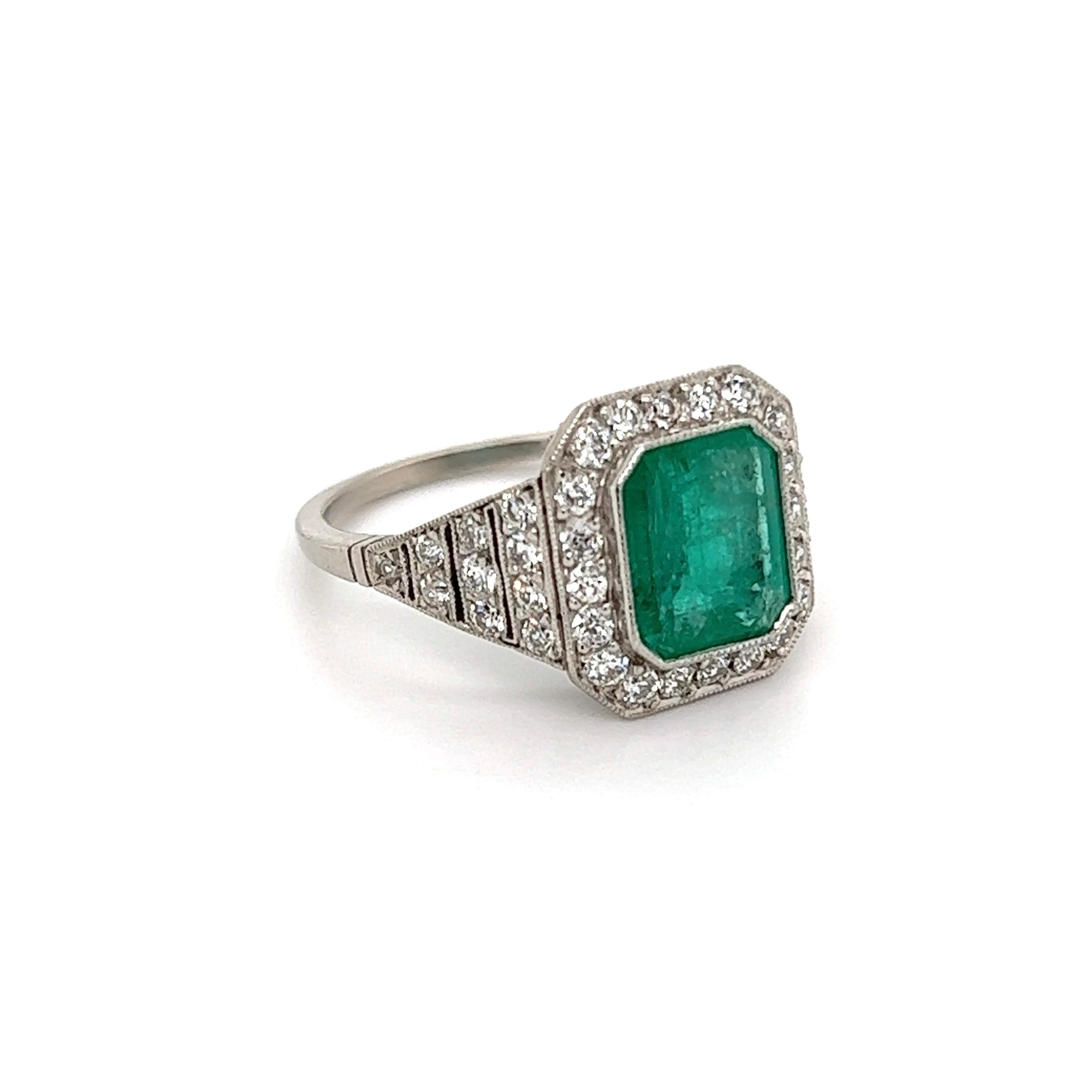 Simply Beautiful! Finely detailed Emerald and Diamond Cocktail Ring, center securely set with an Emerald-Cut Emerald weighing approx. 1.55 Carat surrounded by 40 Old European-Cut Diamonds weighing approx. 0.60tcw. Approx. Dimensions: 0.91” L x 0.75”