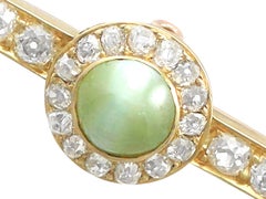 1.55ct Cabochon Cut Chrysoberyl and 1.10ct Diamond Pearl and Gold Bar Brooch