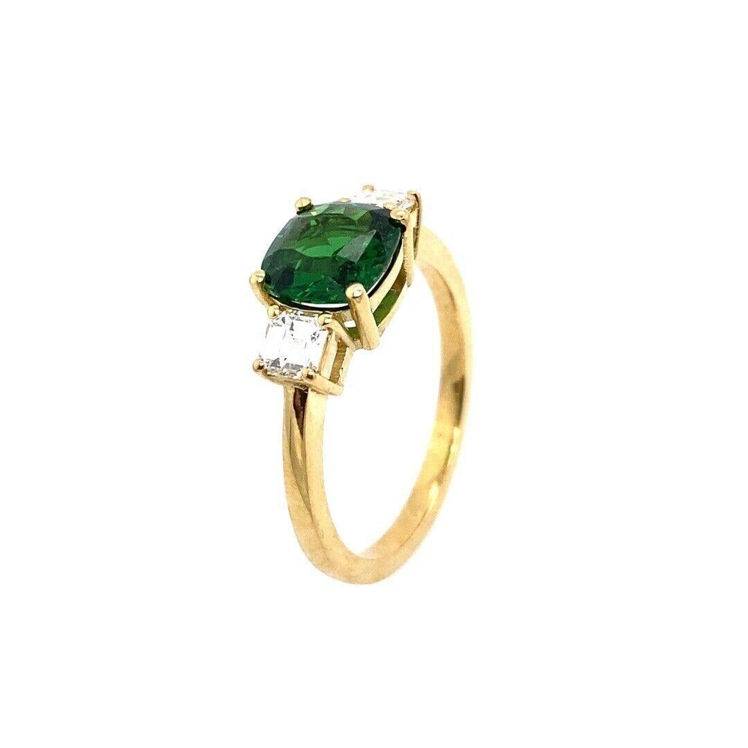1.55ct Cushion Tsavorite 3-Stone Ring, Set With 2 Matching F/VS Asscher 0.40ct
This amazing and elegant 1.55ct cushion shape Tsavorite 3-stone ring, is set With 2 Matching F/VS Asscher Cut Diamonds, 0.40ctThe cushion cut tsavorite is a rare and