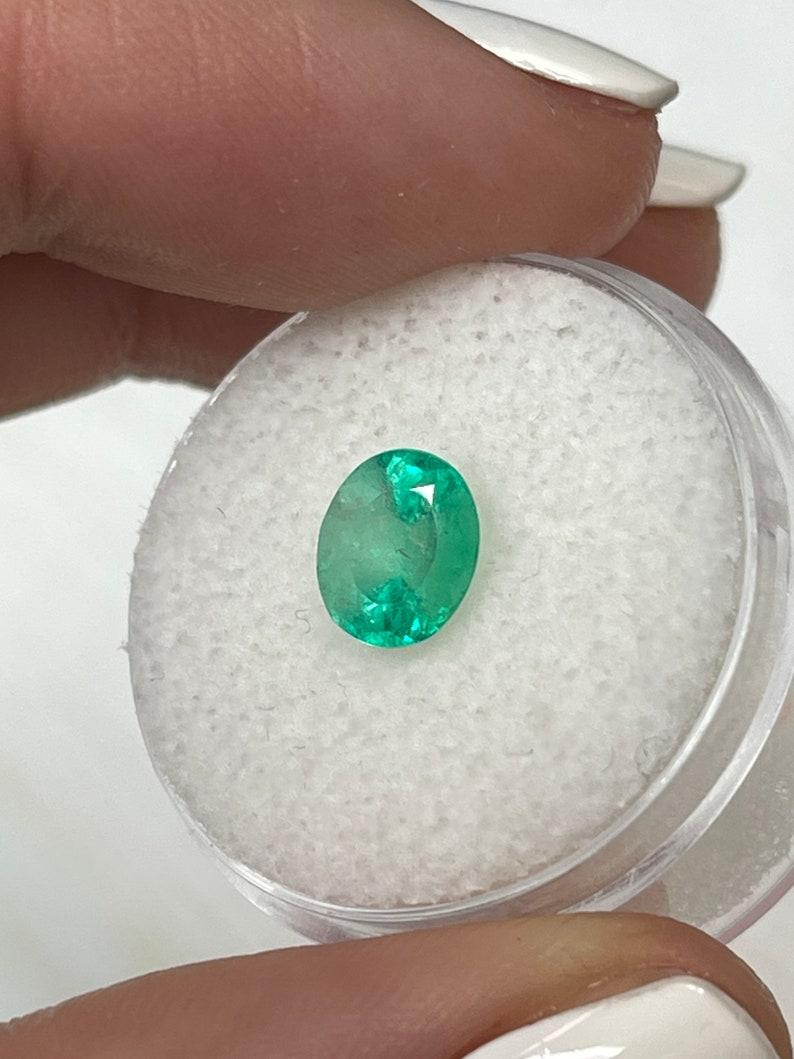 Modern 1.55ct Light Spring Green Natural Colombian Emerald - Oval Cut May Birthstone For Sale
