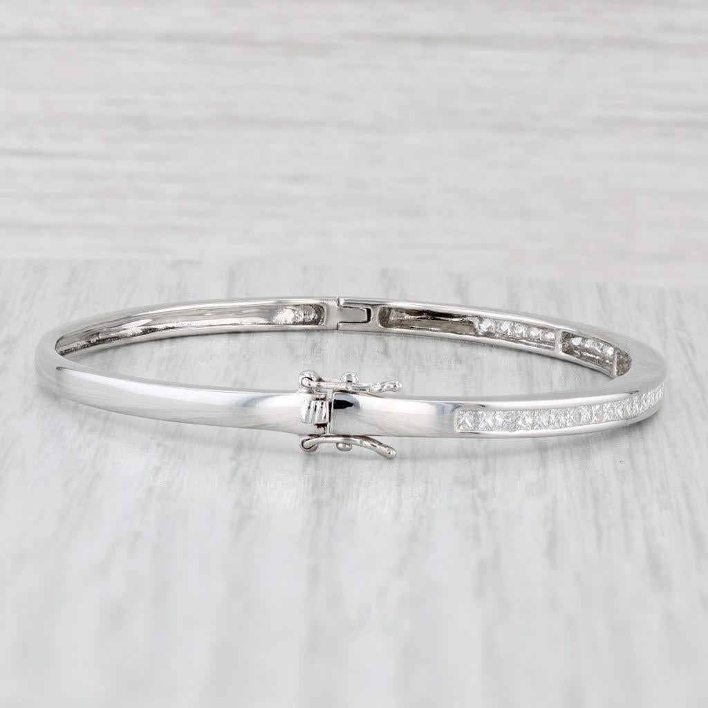 Gemstone Information:
- Natural Diamonds -
Total Carats - 1.55ctw
Cut - Princess Brilliant
Color - G - H
Clarity - VS2 - SI1

Metal: 14k White Gold
Weight: 9.7 Grams 
Stamps: 14k
Chain Style: Bangle
Closure: Hinged with snap and latch
Inner