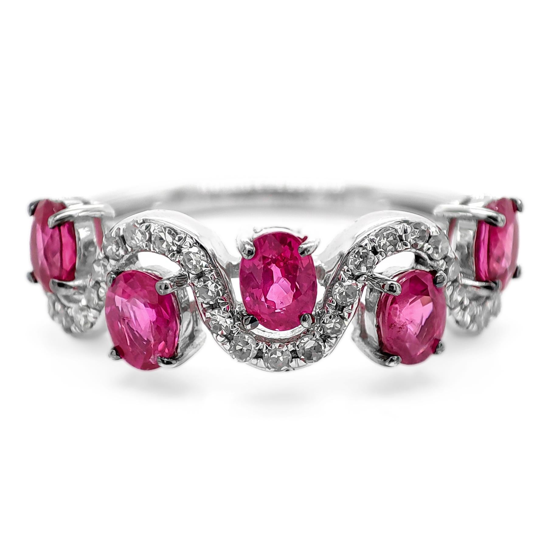 FOR US BUYER NO VAT

You've described a stunning ring featuring five oval-shaped red rubies with a total weight of 1.35 carats. These vibrant rubies are the centerpiece of the design, exuding their rich and passionate red hue.

The rubies are