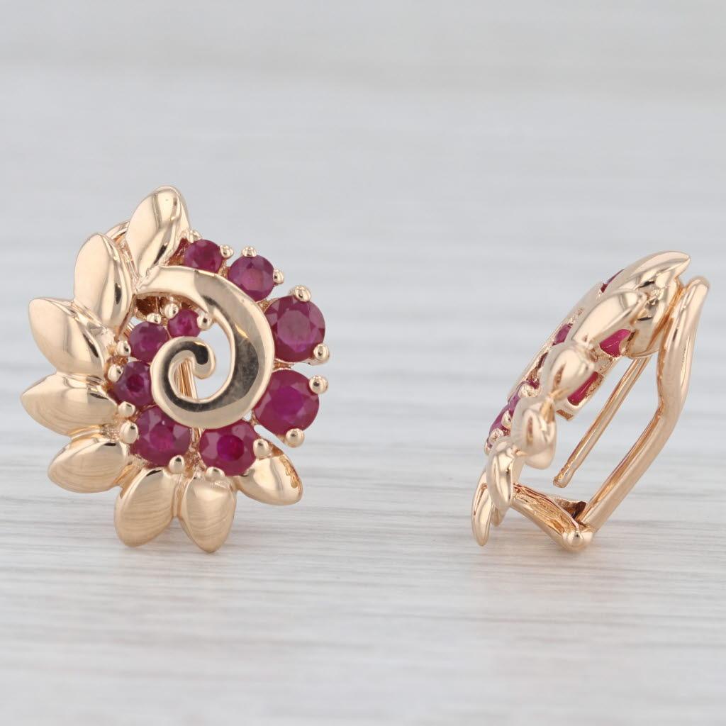 Gemstone Information:
- Natural Rubies -
Total Carats - 1.55ctw
Cut - Round Brilliant
Color - Red

Metal: 14k Yellow Gold 
Weight: 7.4 Grams 
Stamps: 14k
Closure: Clip On Omega Backs - Non Pierced
Measurements: 18.5 x 17.1 mm