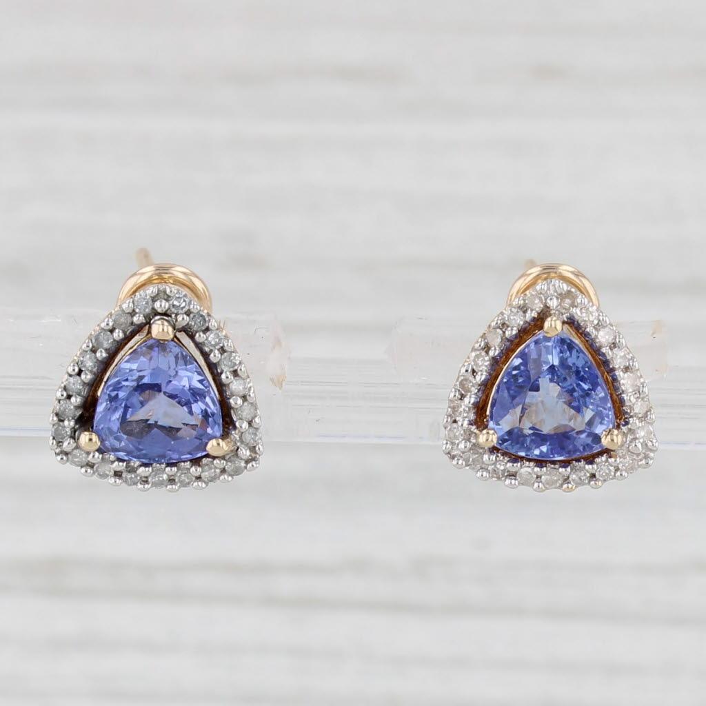 Gemstone Information:
- Natural Tanzanites -
Total Carats - 1.46ctw
Cut - Trillion Brilliant
Color - Purple
Treatment - Heated

- Natural Diamonds -
Total Carats - 0.09ctw
Cut - Single
Color - H - J
Clarity - I2 - I3

Metal: 14k Yellow Gold
Weight: