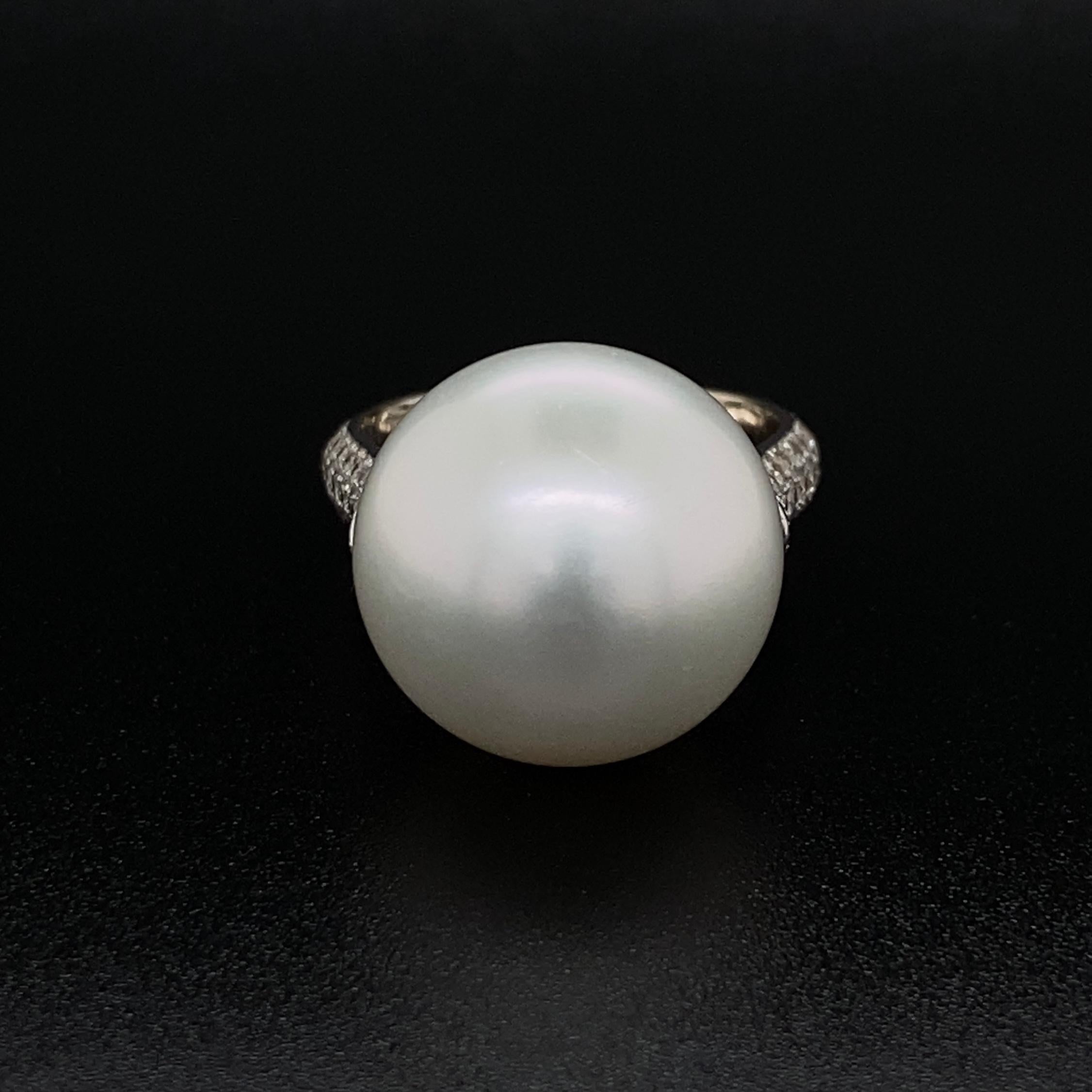 Simply Beautiful! South Sea Pearl and Diamond 18K Gold Ring. Center securely Hand set with a 15.5mm South Sea Button Pearl ring with 74 round brilliant cut Diamonds approx. 0.80tcw set in 3 rows on either side of the shank. Hand crafted 18K white