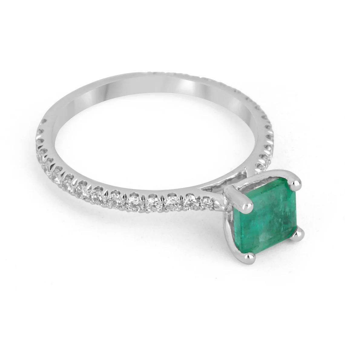 Elegantly displayed is a natural Asscher-cut emerald and diamond ring. The center gem is a beautiful quality, Asscher cut, emerald filled with life and brilliance! Among the emeralds, impressive qualities are their vibrant color and beautiful eye