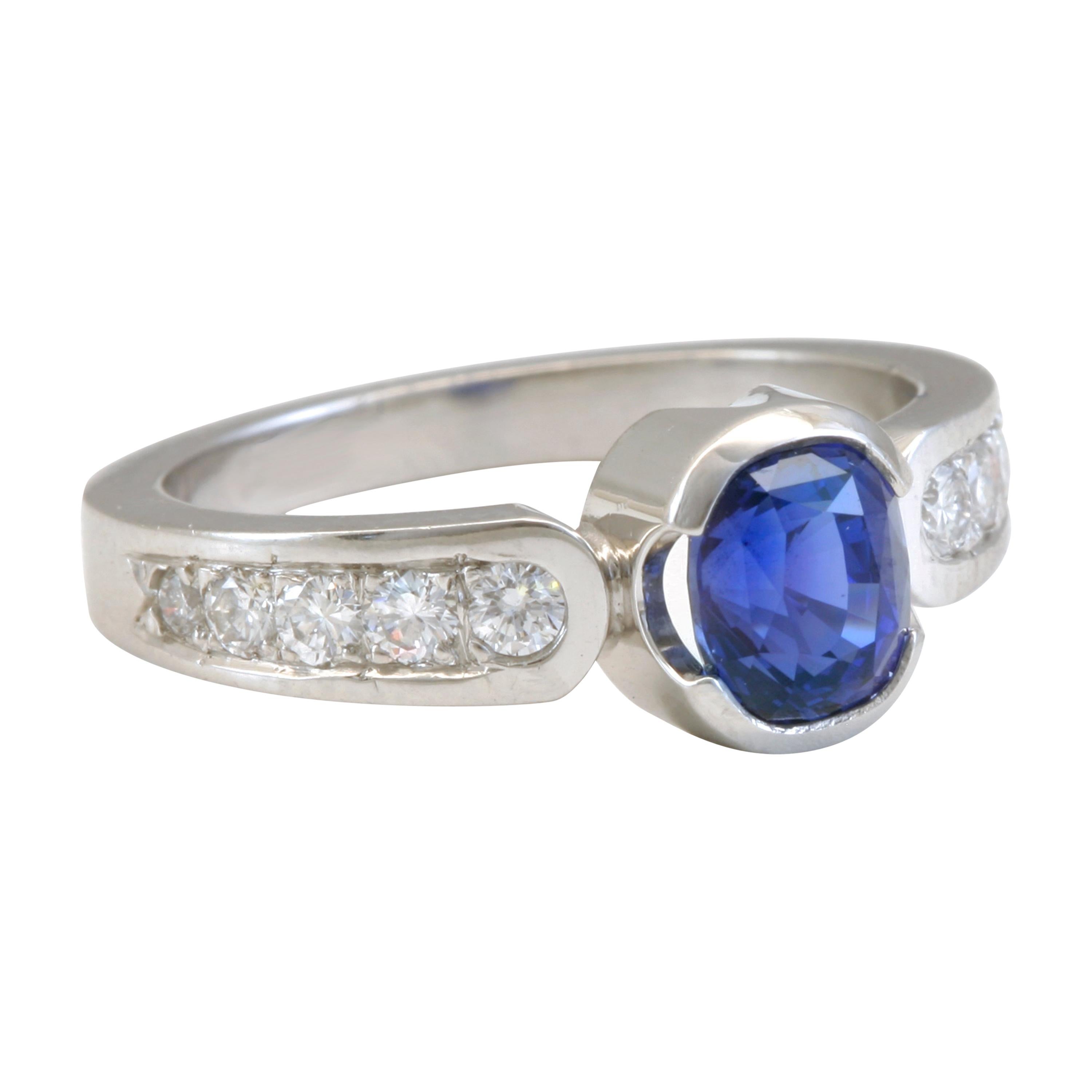 1.56 Carat Blue Sapphire with .34 Carat Diamonds in Platinum For Sale