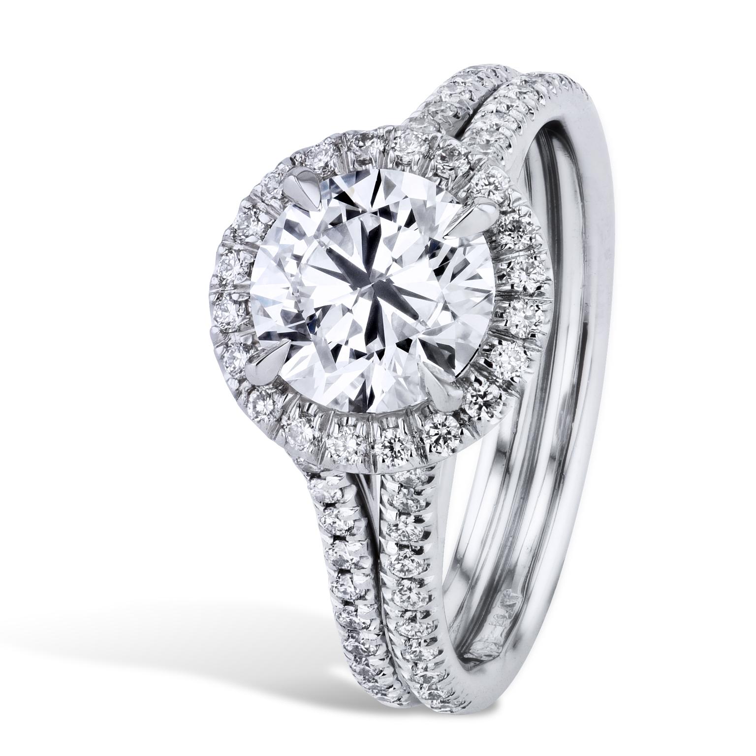 GIA Certified 1.56 Carat Diamond with Pave Set Halo Platinum Engagement Ring

Say I do to this handmade 1.56 carat H-SI1, (EX, EX, EX) round brilliant cut diamond centered in a halo of pave set diamonds (0.14 carats in total weight, G/H-VS), and