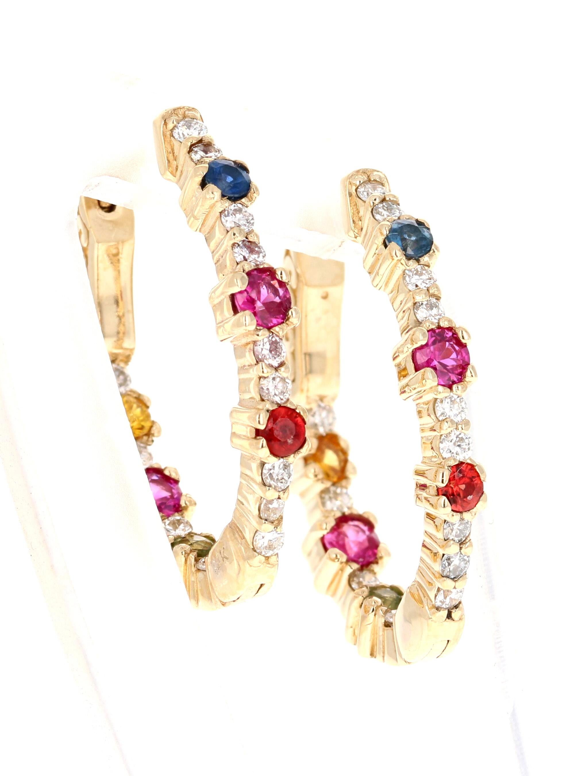1.56 Carat Diamond and Multi Color Sapphire White Gold Hoop Earrings

These stunning earrings have a combination of diamonds and sapphires sparkling around each other. There are Natural Round Cut Diamonds that weigh 0.49 Carats (Clarity: SI1, Color: