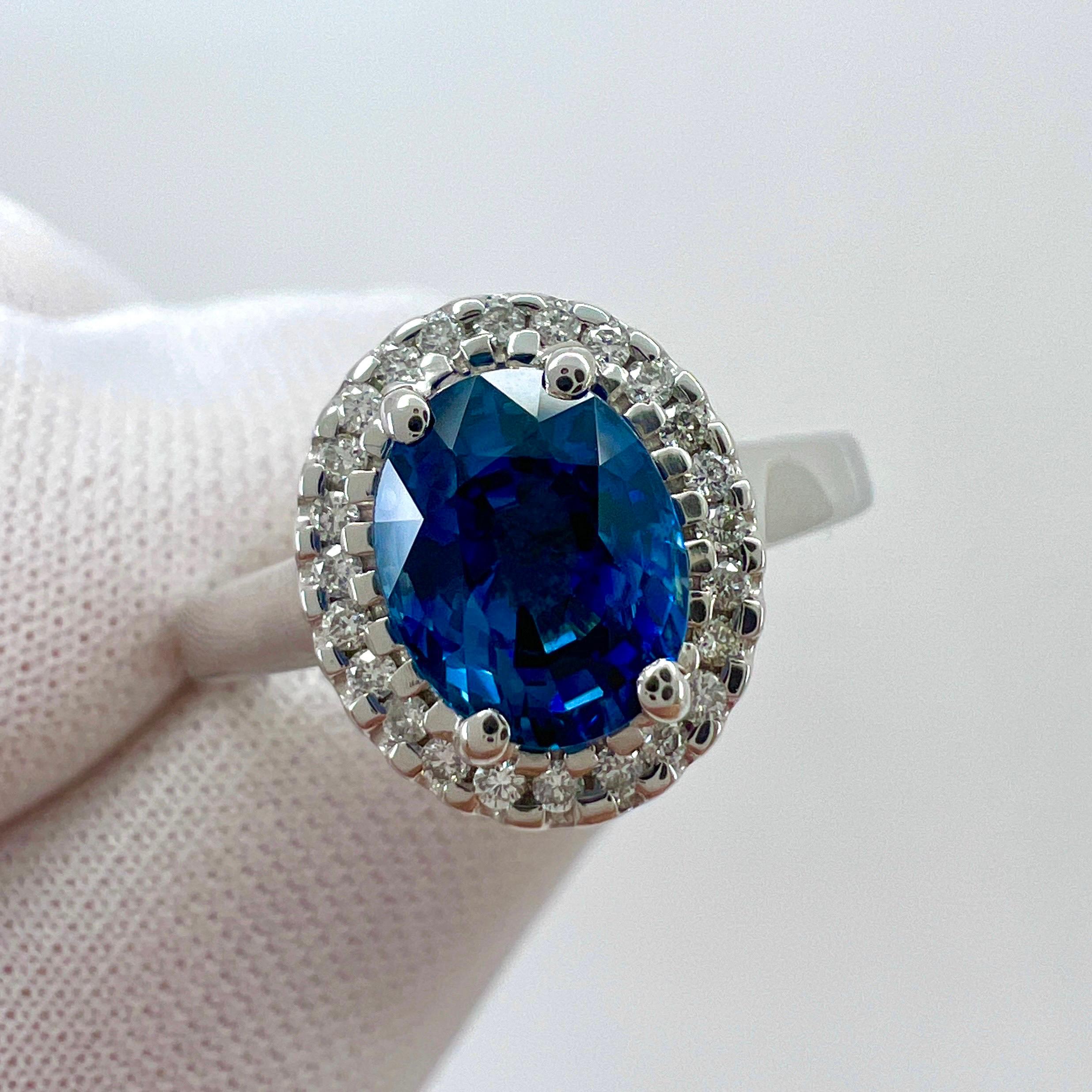 Fine Ceylon Blue Oval Cut Sapphire & Diamond 18k White Gold Halo Ring.

1.56 Carat centre Ceylon sapphire with a beautiful vivid blue colour and excellent clarity. VVS.
This sapphire is Sri Lankan in origin (Ceylon), source of some of the finest