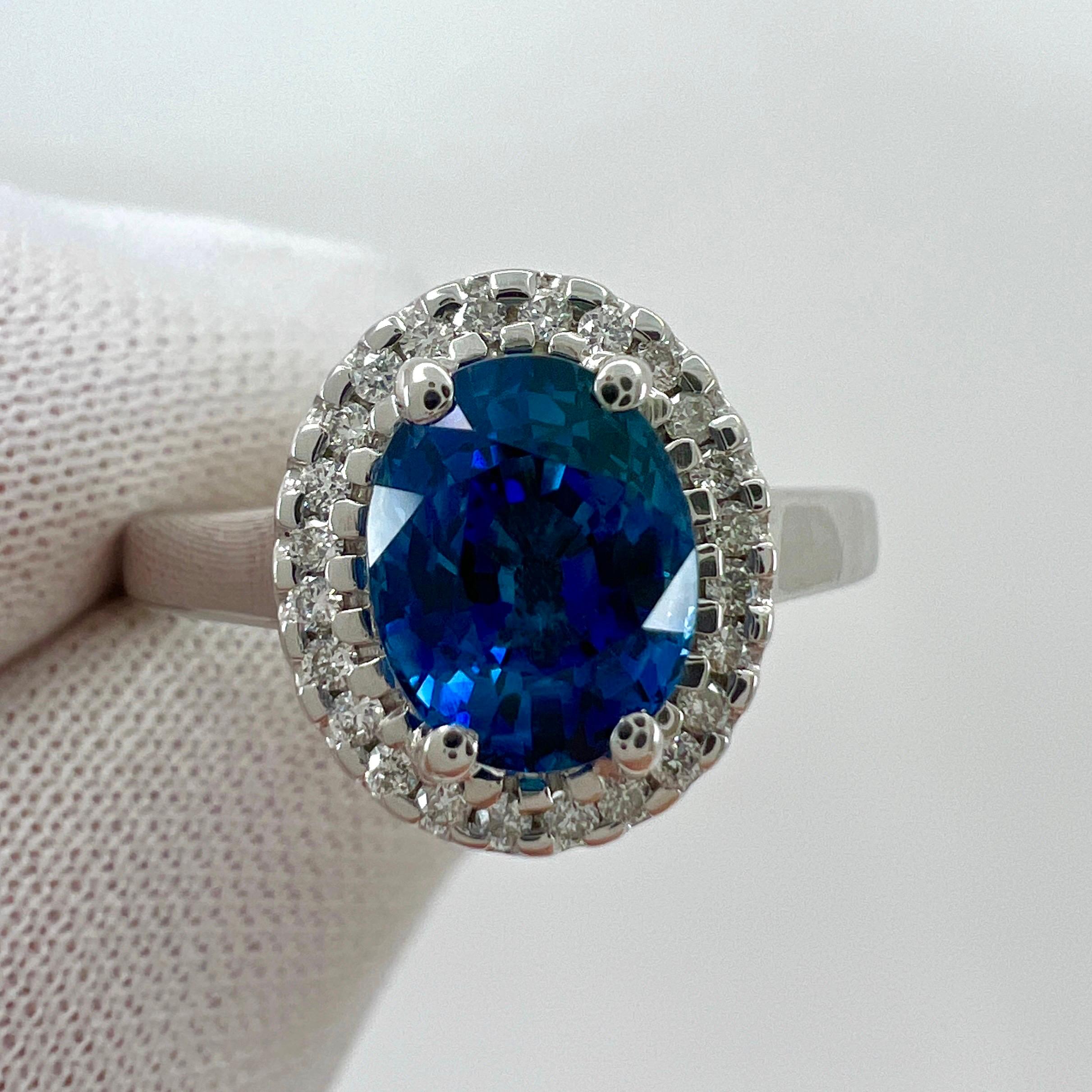 Oval Cut 1.56 Carat Fine Vivid Blue Ceylon Sapphire And Diamond 18k White Gold Halo Ring For Sale