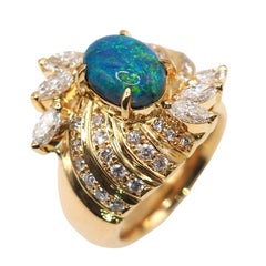 Bague en or jaune 18 carats avec une opale de 1,56 carat et un diamant de 1,25 carat