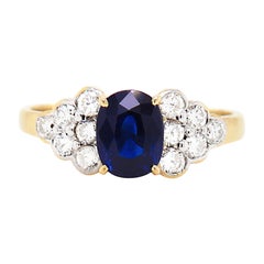 1.56 Carat Oval Sapphire and Diamond 18 Carat Yellow Gold Engagement Ring