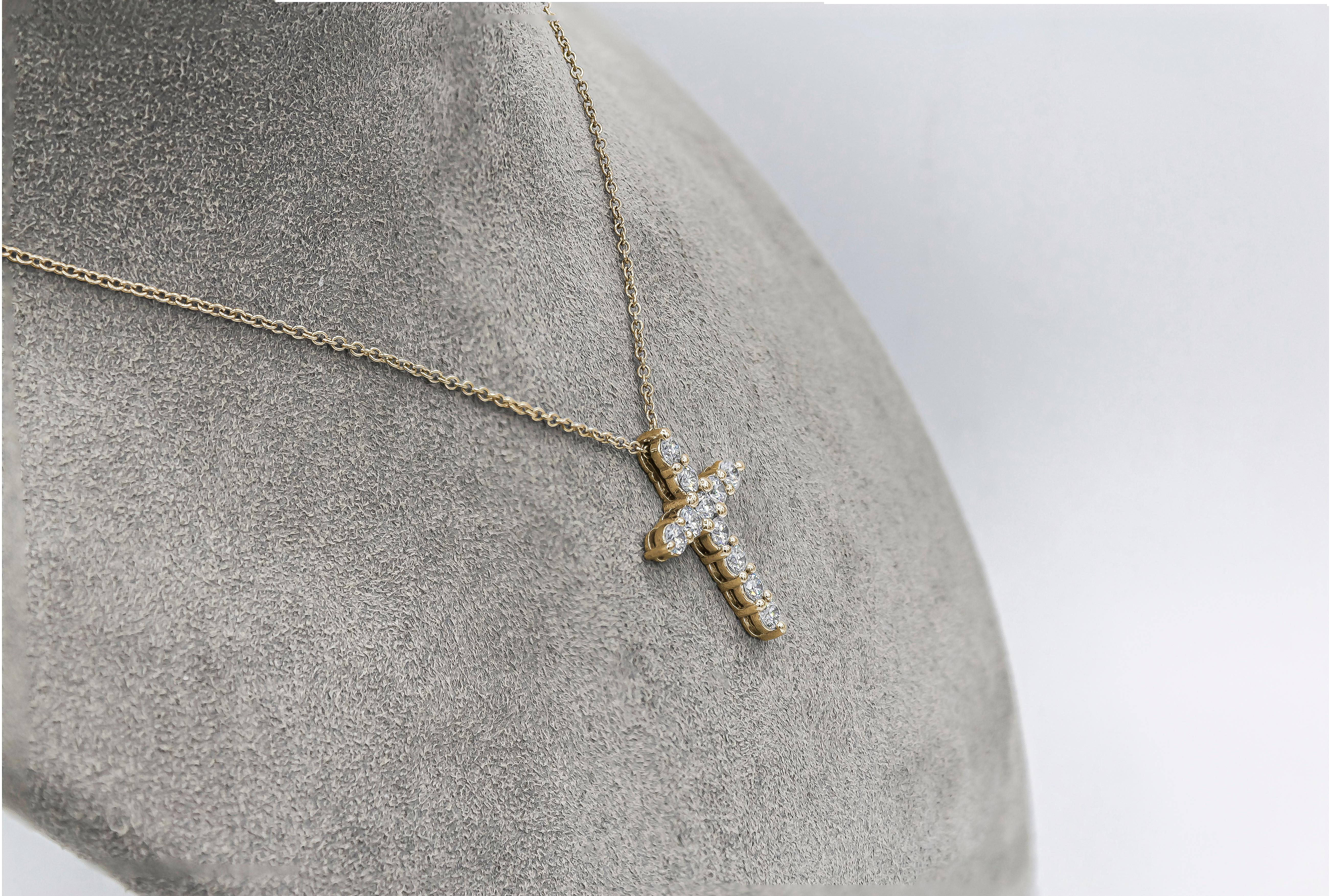 A classic cross pendant necklace set with round brilliant diamonds weighing 1.56 carats total. Diamonds are approximately G color, VS clarity. Made in 14 karat yellow gold.  Suspended in a 16 inch yellow gold chain (adjustable upon request).

Style