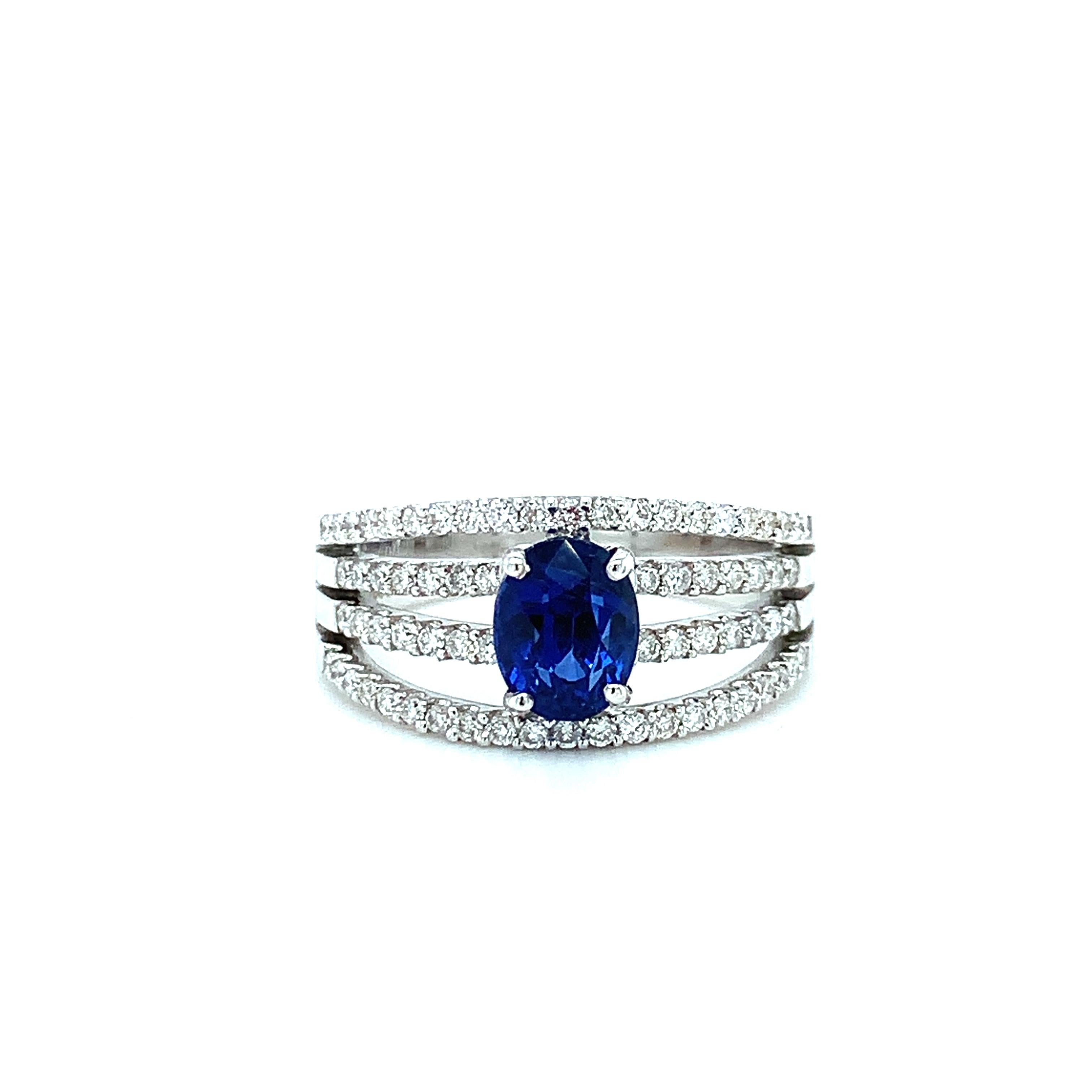 A stunningly vibrant blue sapphire sits front and center in this gorgeous 18k white gold ring. The sapphire is a beautiful oval brilliant cut, weights 1.56 carats and is the ideal shade of royal blue! Sparkling round brilliant-cut white diamonds