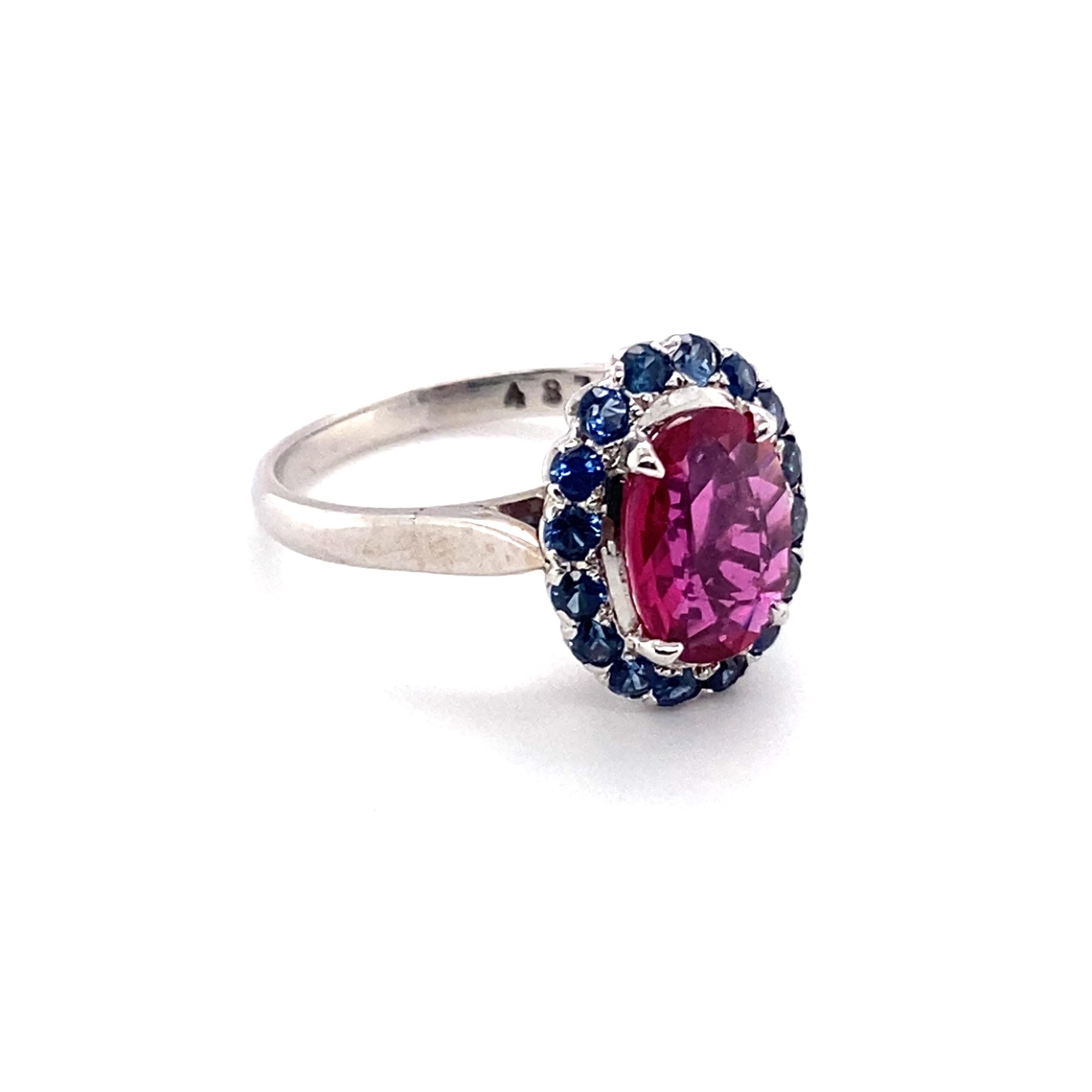 Item Details:
Size: 6.75, can be resized
Metal: 14 Karat White Gold
Weight: 3.9 grams

Ruby Details:
Carat: 1.56 carat total weight
Cut: Oval
Color: Red

Sapphire Details:
Cut: Round
Carat: 1.14 carat total weight
Color: Blue

Item Features:
This