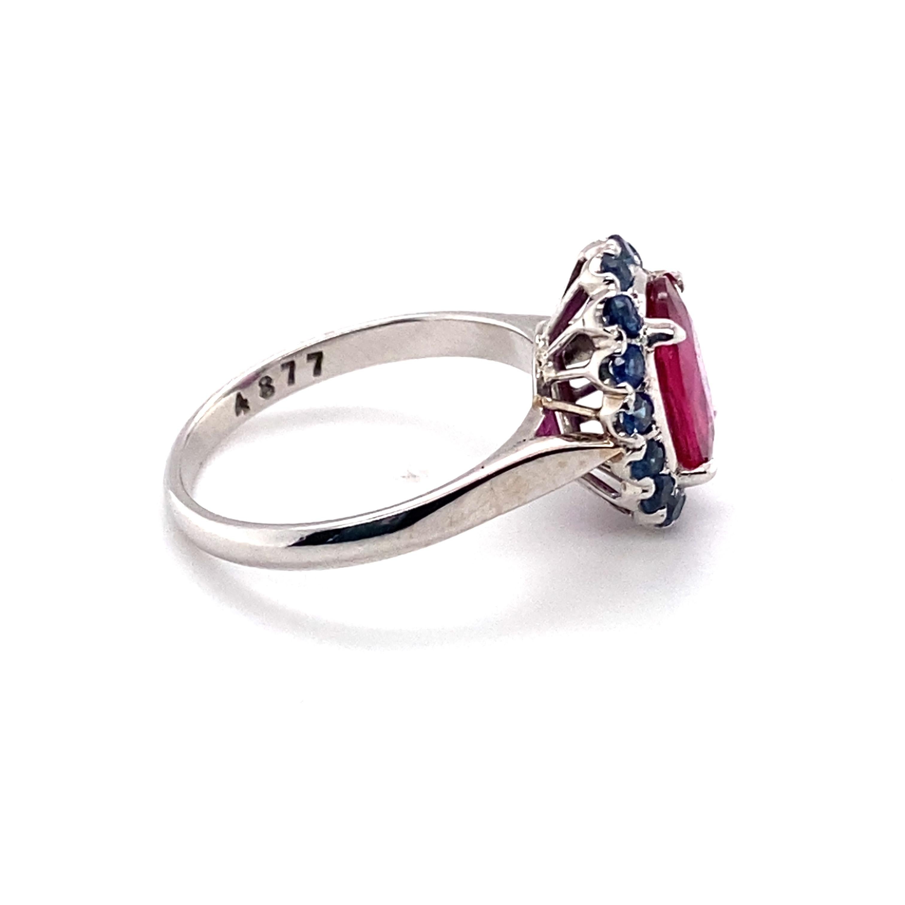 Modern 1.56 Carat Total Ruby and 1.14 Carat Total Sapphire Ring in 14 Karat White Gold For Sale
