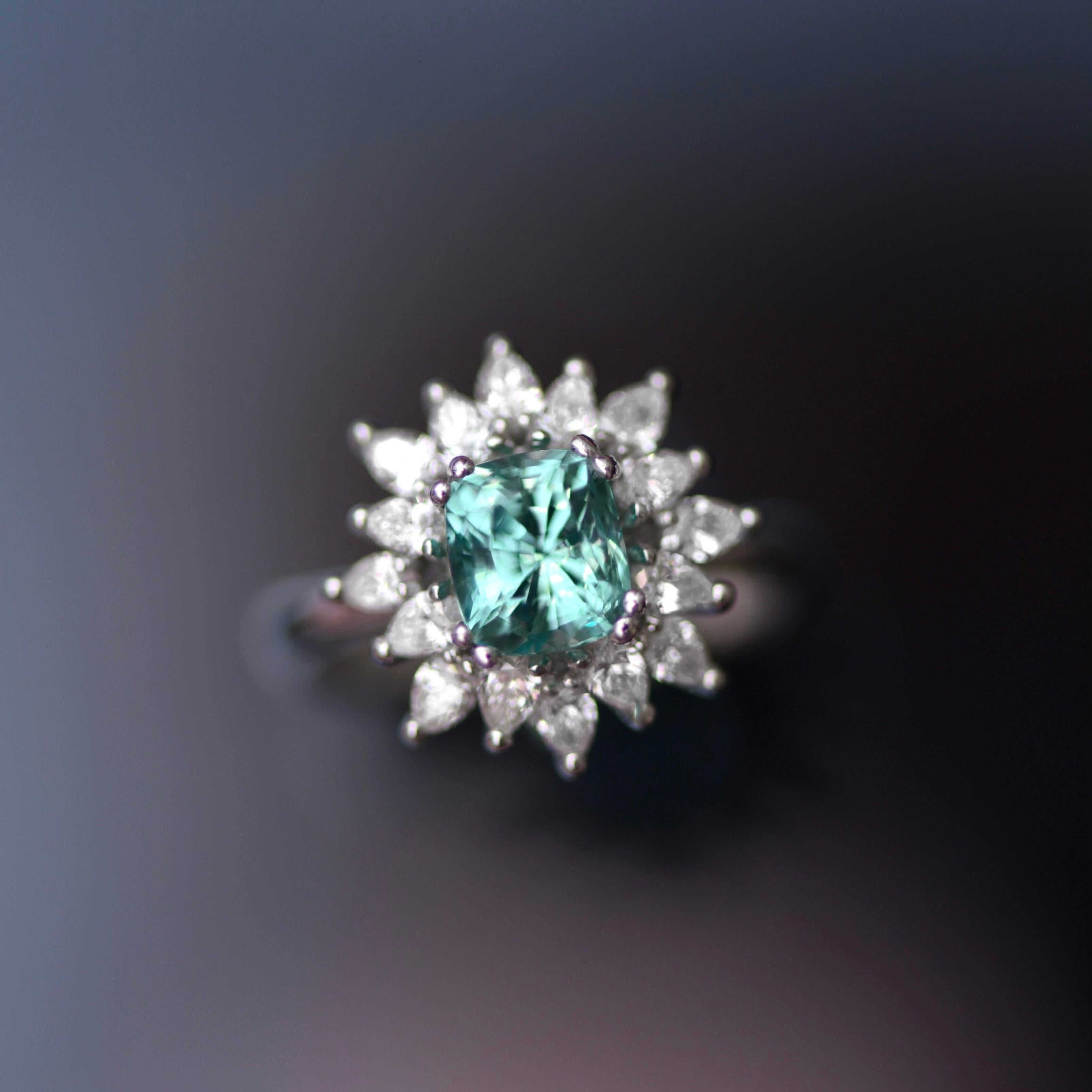One of a kind ring with rare Vanadium Chrysoberyl is designed as a delicate diamond ring. 
Vanadium Chrysoberyl is a very rare gem and it's very hard to find it. 
Cause it is one of a kind gem the best frame for it are white pear shape diamonds and