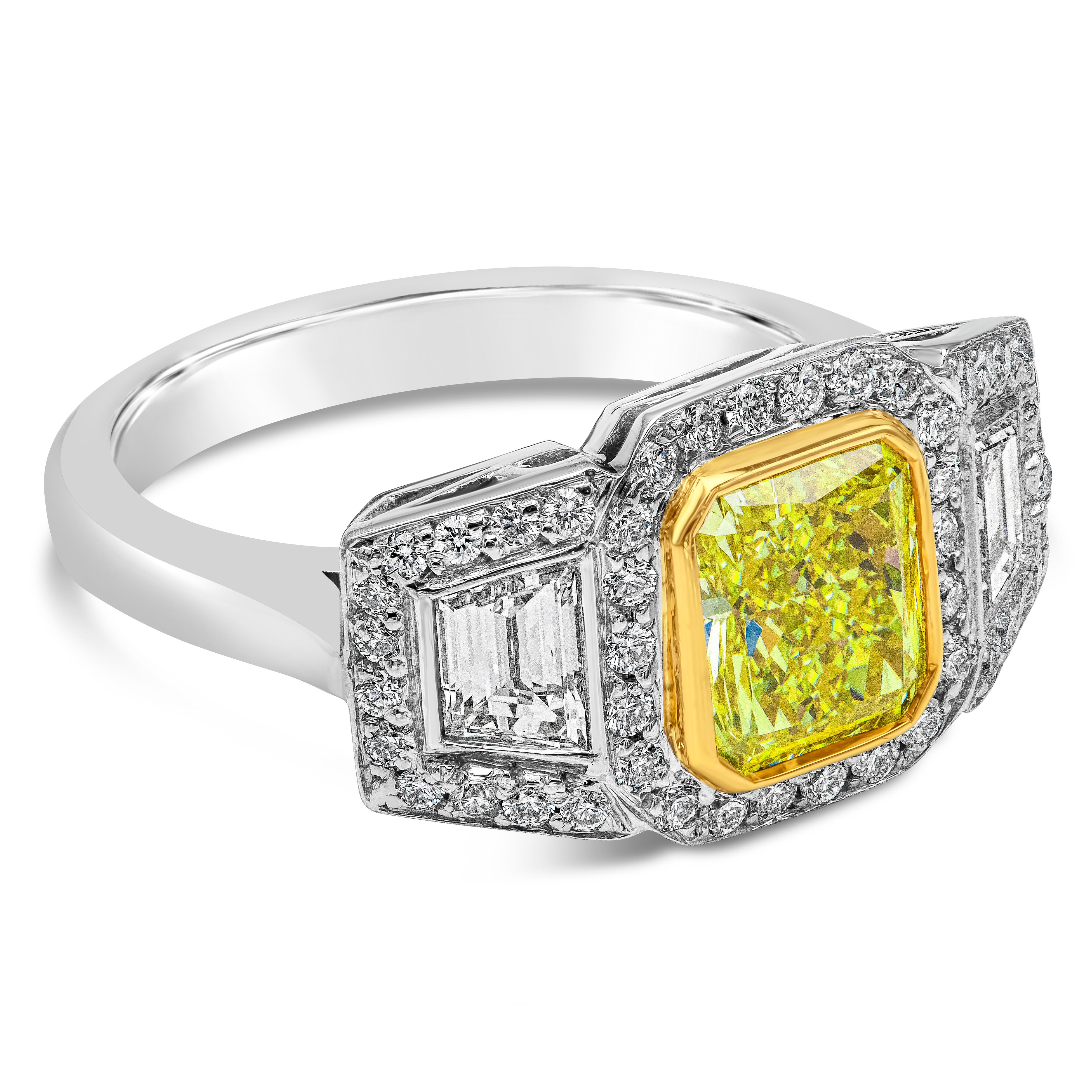 This stunning three stone engagement ring is set with a 1.56 carats fancy intense yellow diamond center stone flanked with trapezoid diamond side stones weighing 0.62 carats. GIA certified the center stone as fancy intense yellow color and VS1 in