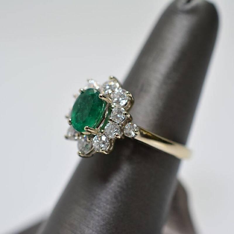 1.56 Oval Cut Emerald with 1.06 Carats of Diamond Cocktail Ring
14 karat white gold oval shaped emerald and diamond ring.  The Emerald weighs 1.56ct and there are 1.06 cts of Diamonds surrounding the center stone. The diamonds are VS F-G in