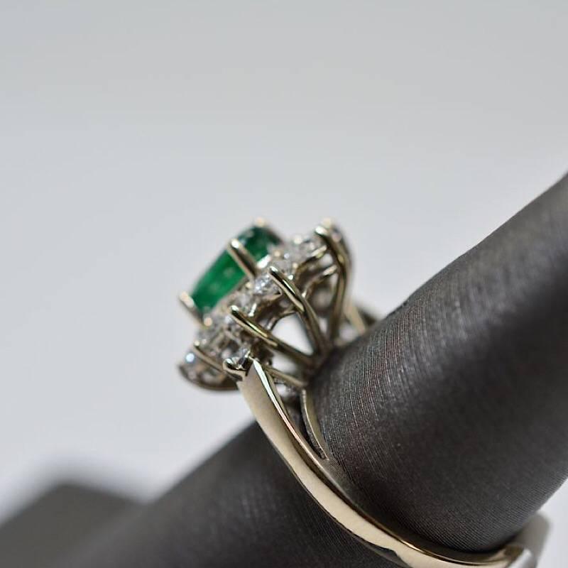 Contemporary 1.56 Oval Cut Emerald with 1.06 Carat of Diamond Cocktail Ring For Sale