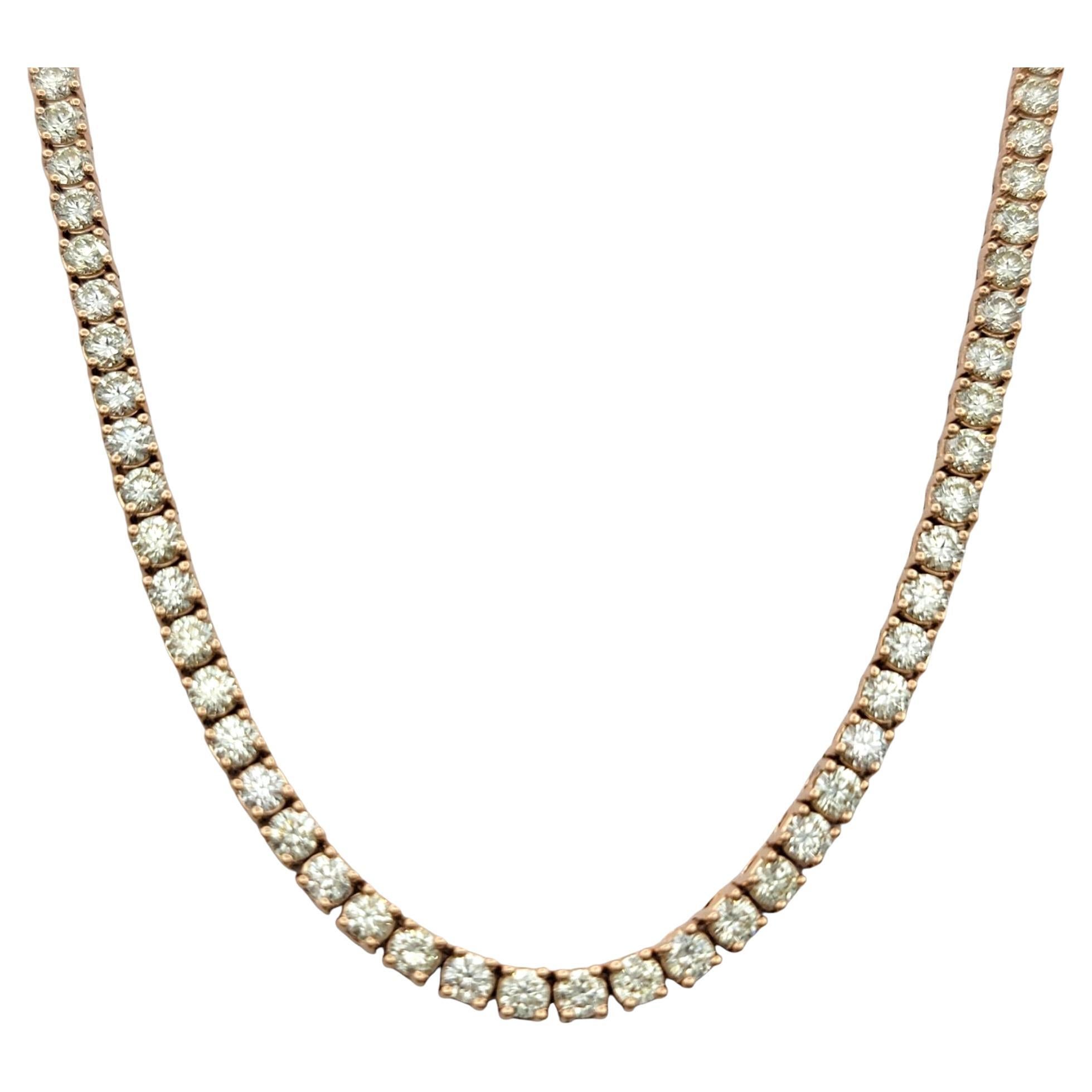 Command attention with this breathtaking diamond tennis necklace, an opulent expression of elegance and refinement. Featuring a continuous line of round brilliant cut diamonds, this piece glows with remarkable brilliance, enhanced by its substantial