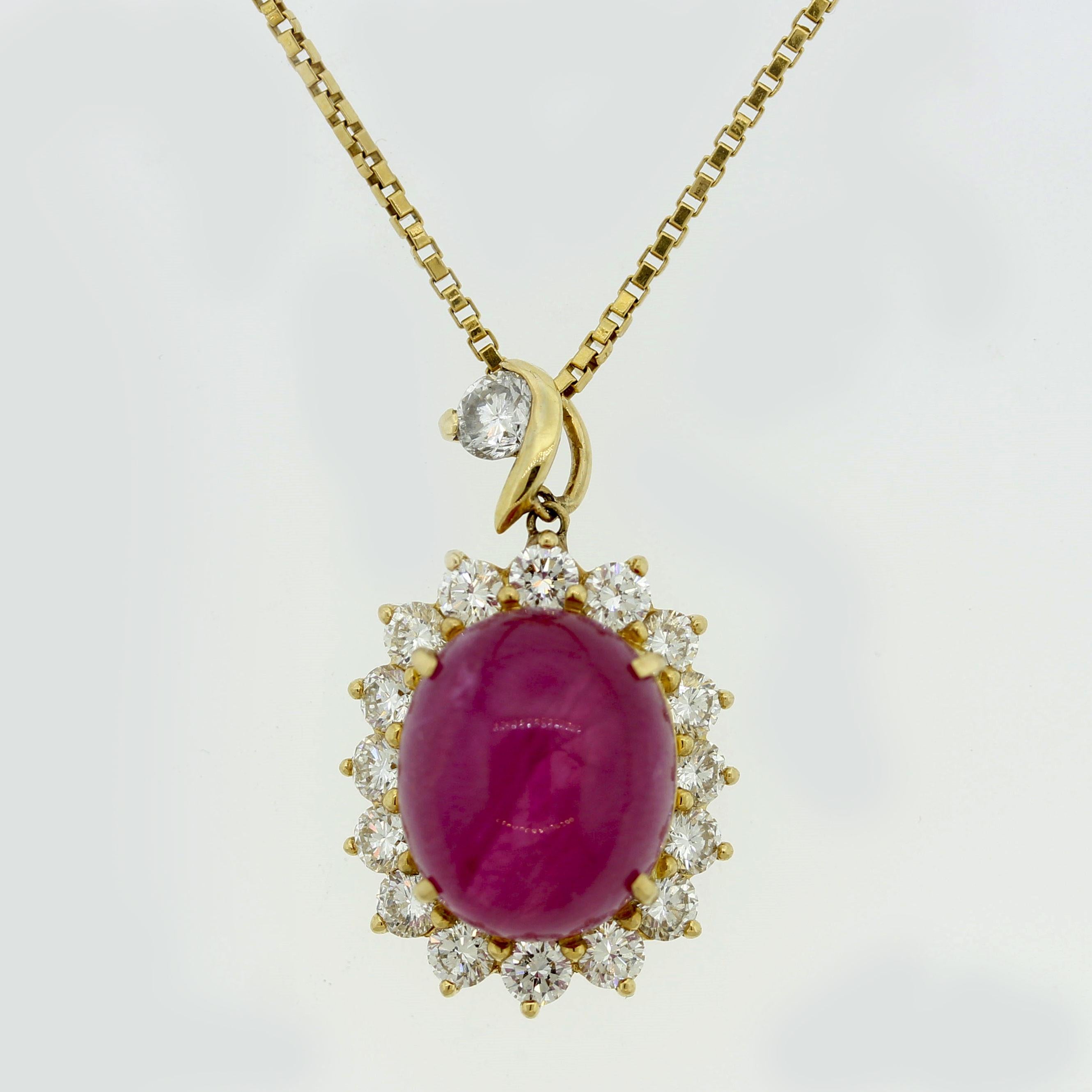 A 15.60 carat natural ruby, certified by the GIA, is the centerpiece to this special pendant. Rubies are the hardest of the big 3 gemstones (ruby, sapphire, emerald) to find in large sizes with nice color. Anything over 5 carats is rare, but 15