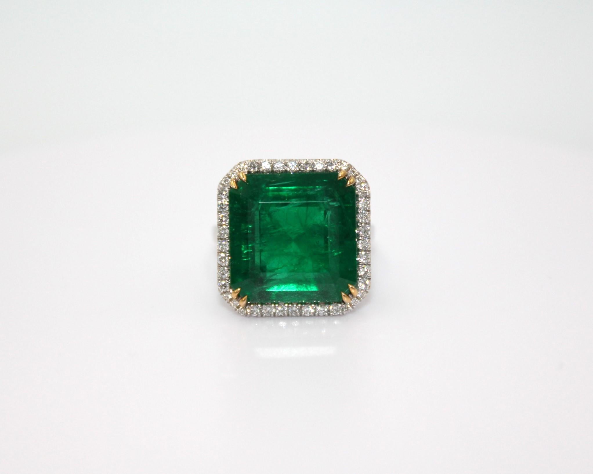 15.61 carats emerald-cut Zambian Emerald framed with 40 round shaped diamonds, totaling diamond weight of 0.55 carat. 

This gorgeous Emerald Diamond Ring will highlight your elegance and uniqueness. 

Item Details:
- Type: Ring
- Metal: 18K 
-