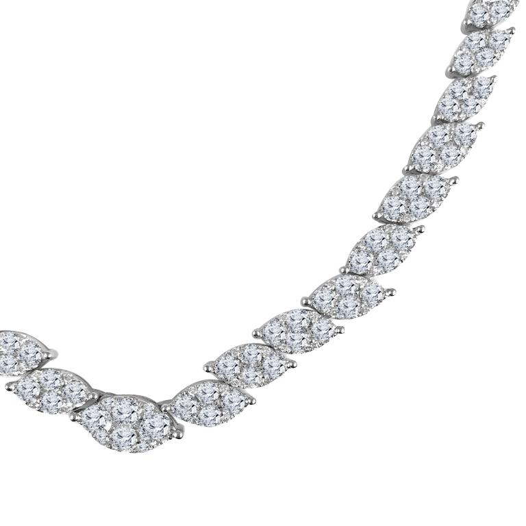 Prepare to be enraptured by a necklace of unparalleled luxury and beauty. This stunning necklace is a true masterpiece, a symphony of 15.62 carats of natural white diamonds, meticulously arranged in graduated clusters that mimic the enchanting