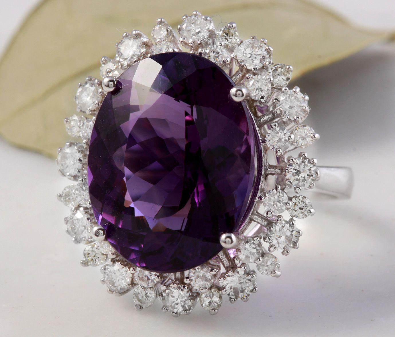 15.65 Carats Natural Amethyst and Diamond 14K Solid White Gold Ring

Total Natural Oval Shaped Amethyst Weights: 14.25 Carats (VVS)

Amethyst Measures: 18 x 14mm

Natural Round Diamonds Weight: 1.40 Carats (color F-G / Clarity VS2-SI1)

Ring size: 7