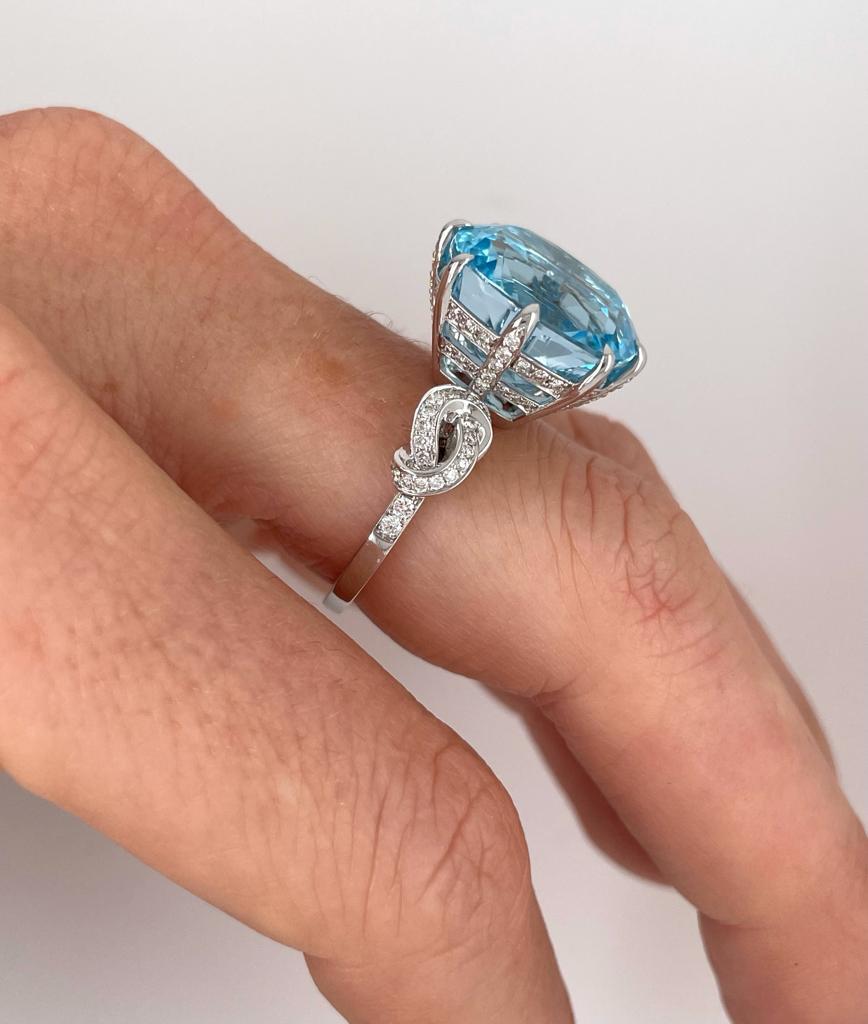 For Sale:  15.66ct Blue Topaz and Diamond Forget Me Knot Ring 14