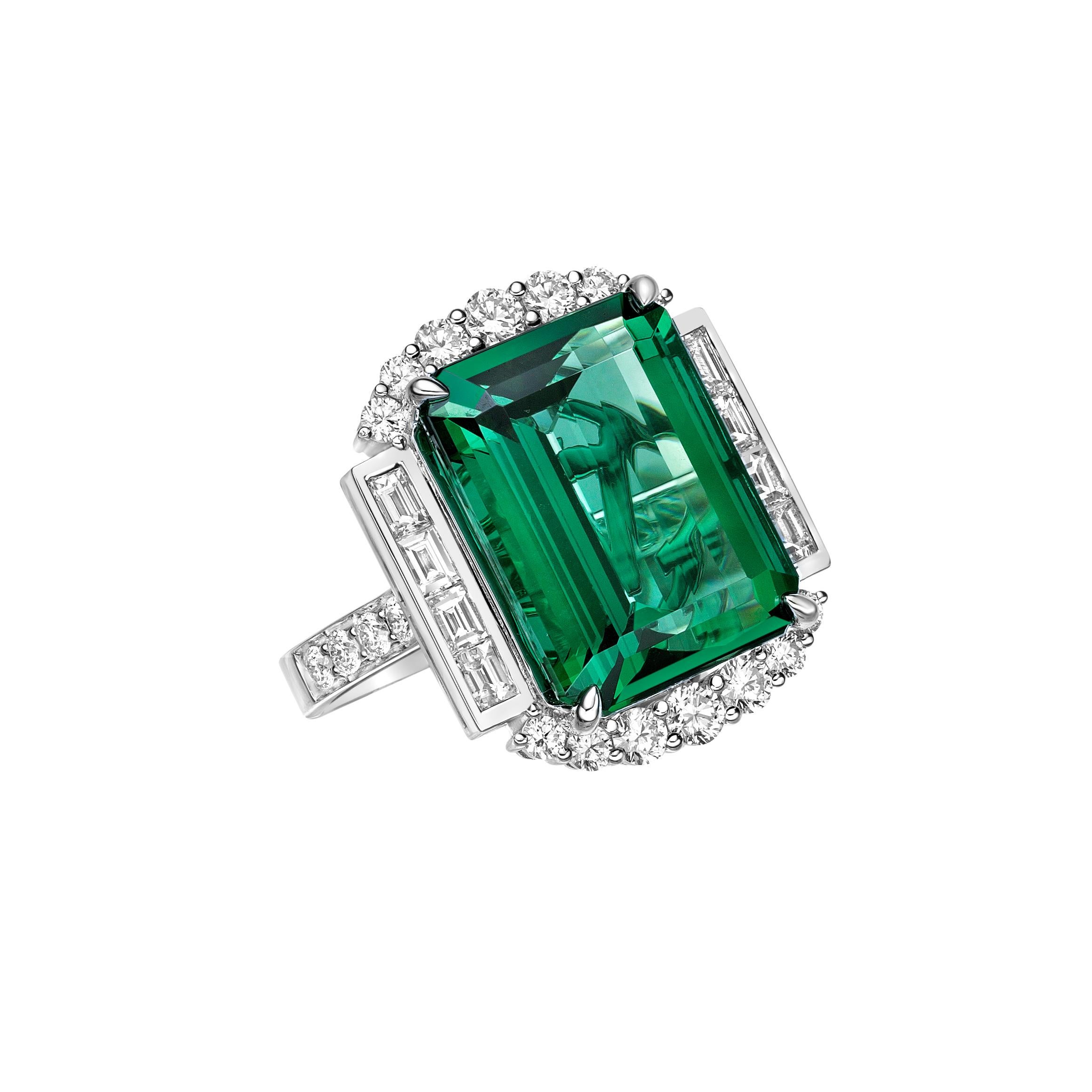 This collection features an array of Green Tourmaline with a Green hue that is as cool as it gets! Accented with diamonds this ring is made in white gold and present a classic yet elegant look.

Green Tourmaline Ring in 18 Karat White Gold with
