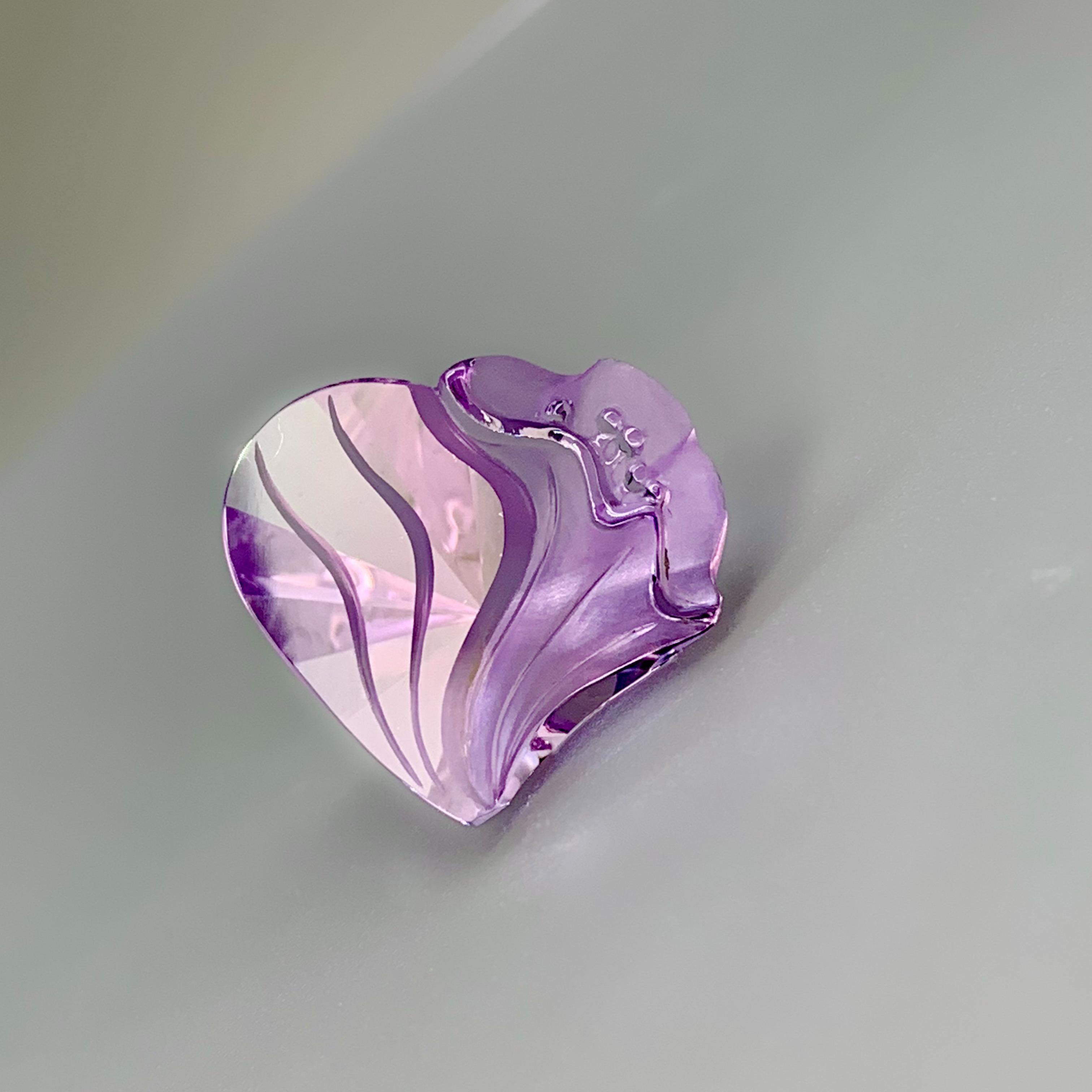 This gorgeously hand carved lavender amethyst from Idar Oberstein Germany (a world famous gem cutting region known for it's artistry and quality) is a piece that is meant to be seen from every angle. It has an overall heart shape with amazingly