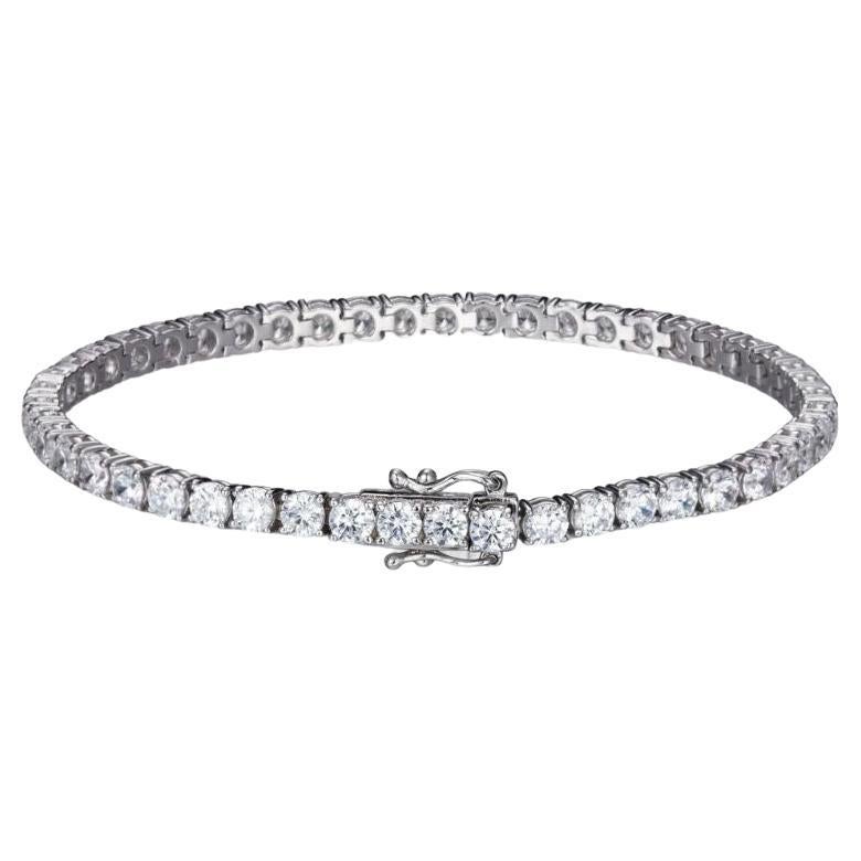 This beautiful bracelet is a timeless classic.

Wear on it's own or with other bracelets.

Featuring 15.68ct of round brilliant cuts, set in 925 sterling silver and finished with either a 14kt yellow gold or a high gloss white rhodium