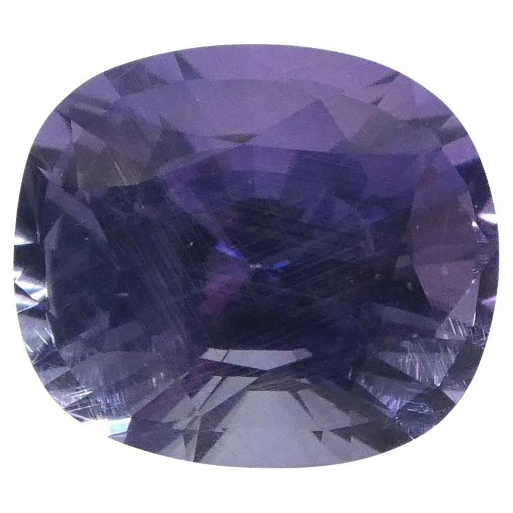 This is a stunning GIA Certified Color Change Sapphire 

The GIA report reads as follows:

GIA Report Number: 2205978743
Shape: Oval
Cutting Style: 
Cutting Style: Crown: Brilliant Cut
Cutting Style: Pavilion: Step Cut
Transparency: