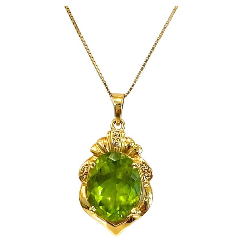 15.6ct Peridot Crest Pendant with Diamonds, 18K Yellow Gold, 1" Long For Sale