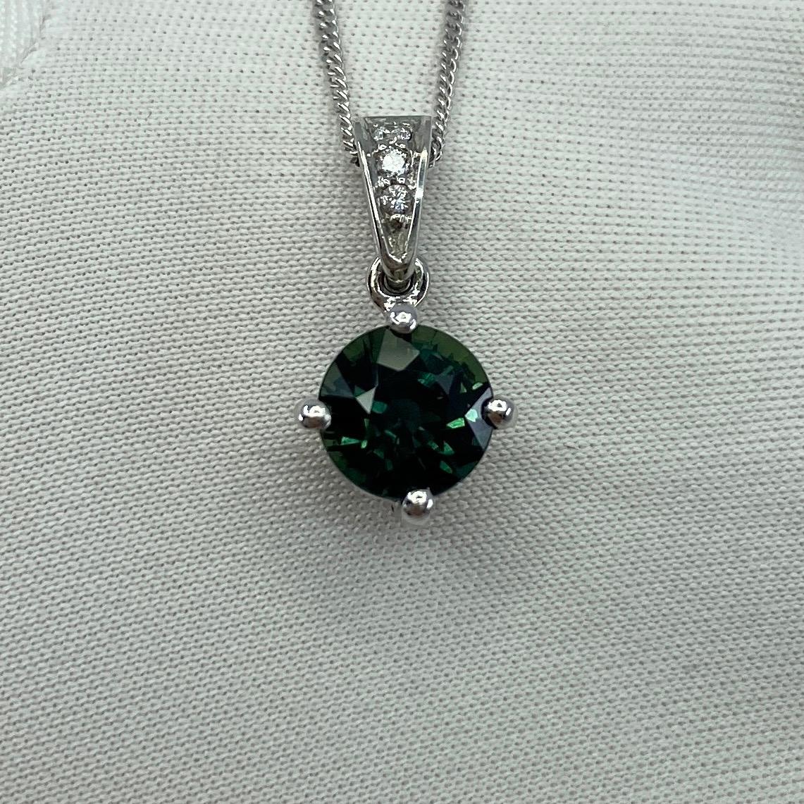 Fine Teal Blue-Green Australian Sapphire & Diamond Platinum Pendant.

1.56 Carat round cut sapphire with a stunning deep blue green 'teal' colour and excellent clarity. Very clean stone practically flawless.
This sapphire also has an excellent round