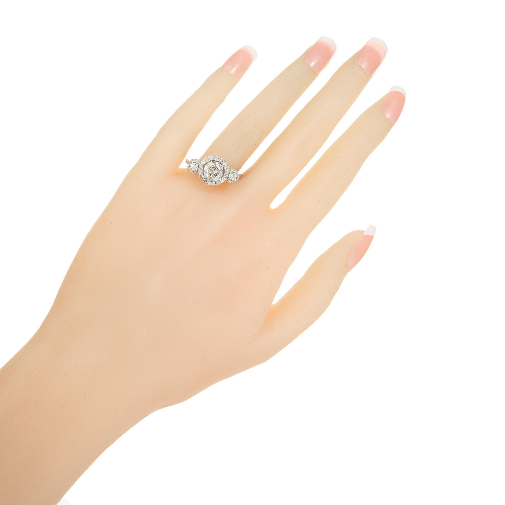 Women's 1.57 Carat Diamond Three-Stone Halo Gold Engagement Ring For Sale
