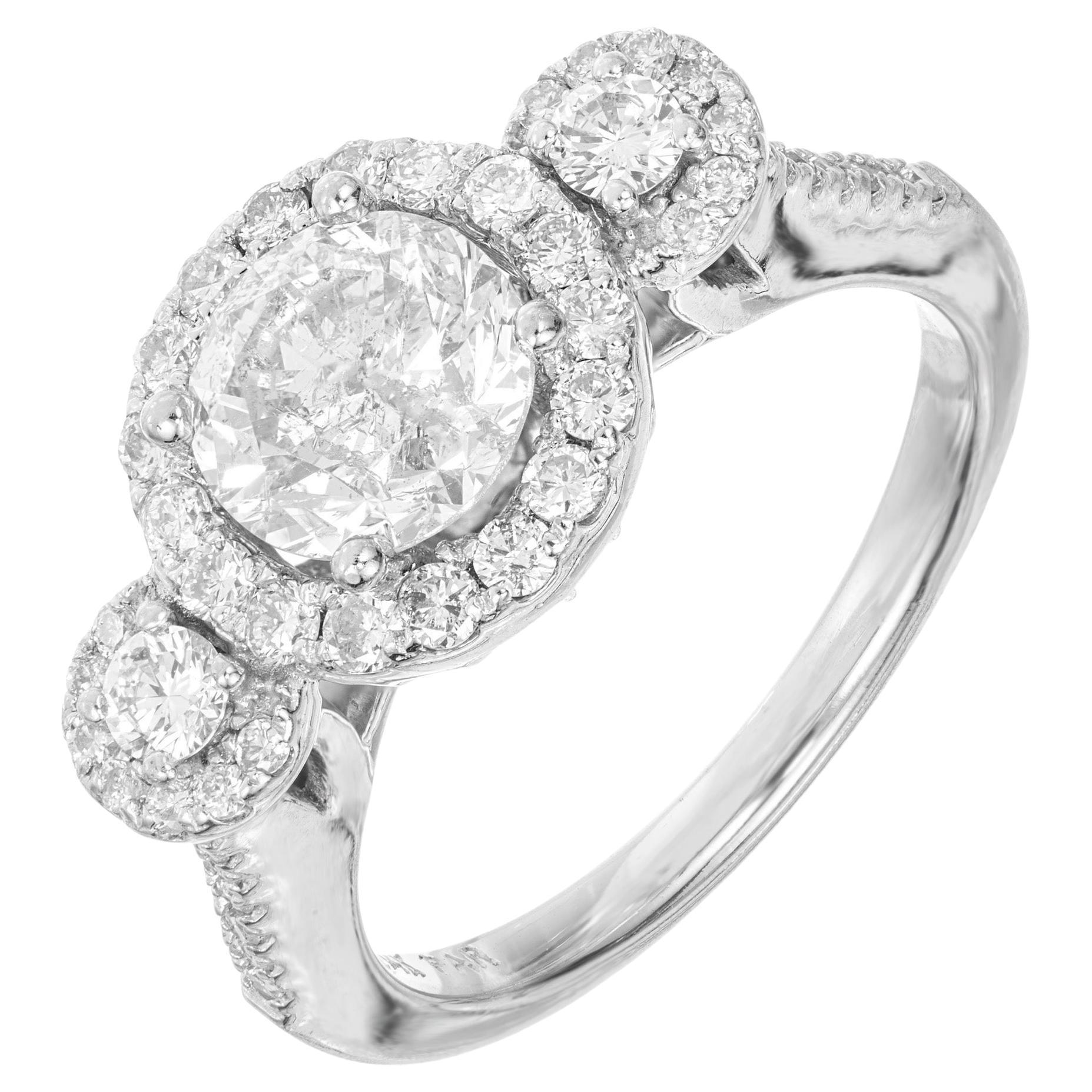 1.57 Carat Diamond Three-Stone Halo Gold Engagement Ring For Sale