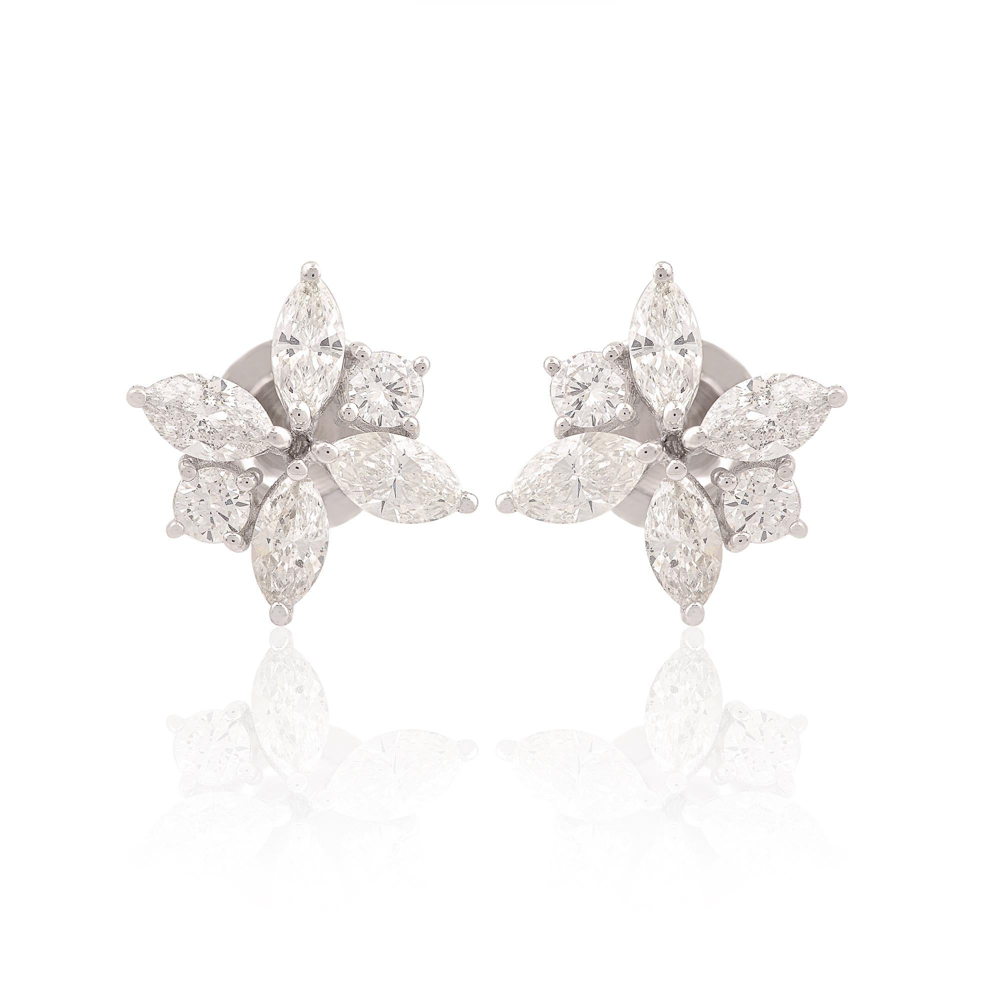 Indulge in the timeless elegance of these exquisite diamond stud earrings, each boasting a combination of marquise and round-cut diamonds set in luxurious 14 karat white gold. Crafted with meticulous attention to detail, these earrings exude