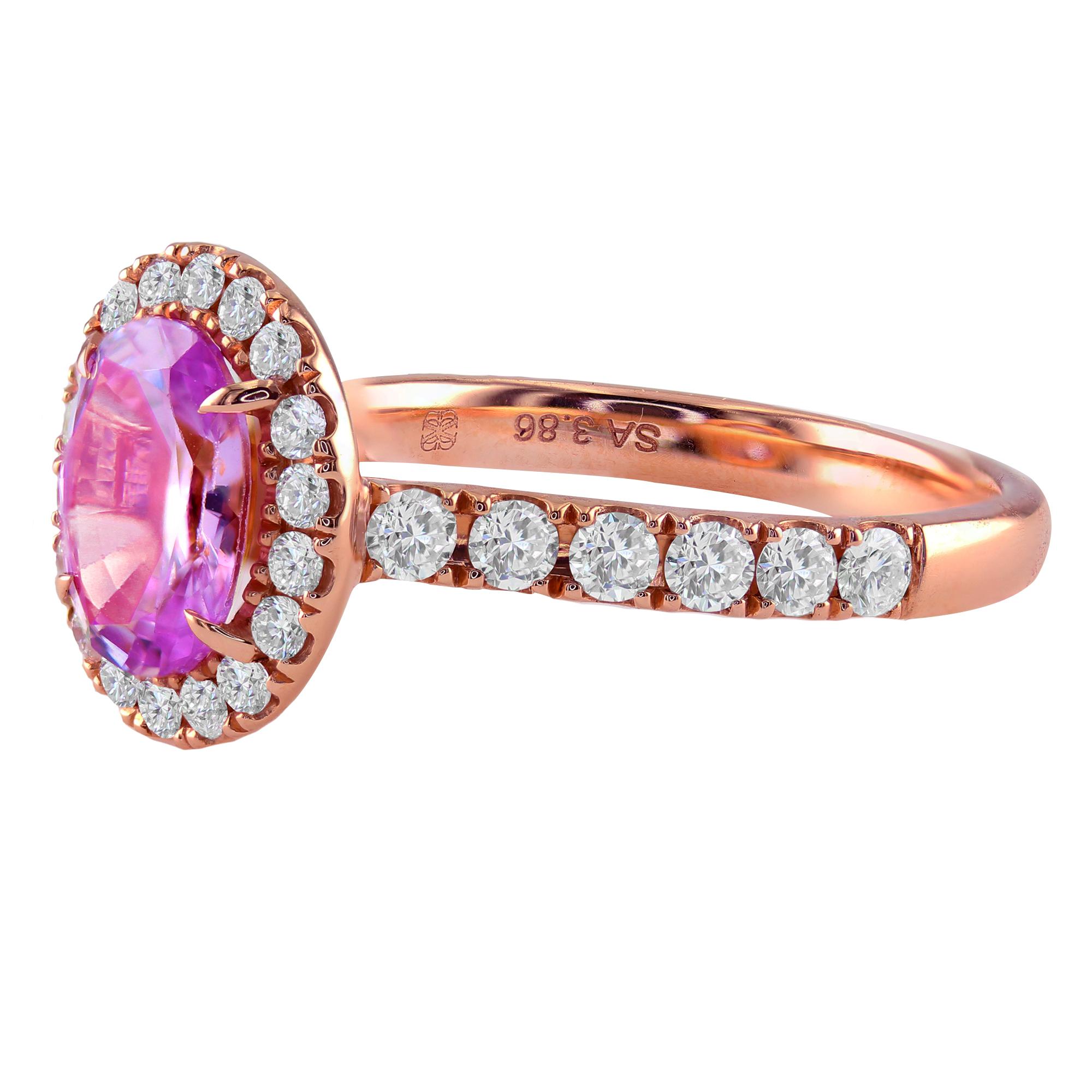 1.57 carat oval pink sapphire ring, surrounded by 0.64 carat round diamonds, set in 18K Rose Gold.

If you are looking for a unique and gorgeous one-of-a-kind engagement ring, this is the perfect piece for you. With its beautiful pink and rose gold