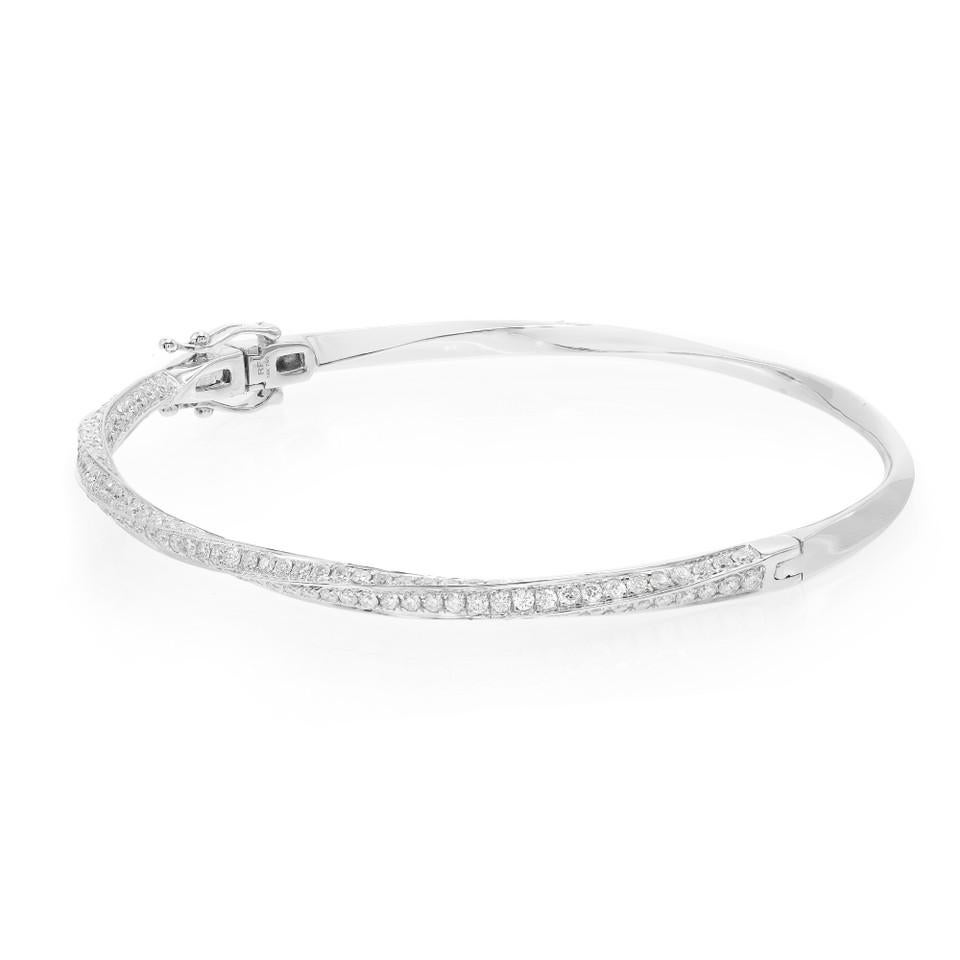Introducing our exquisite 2.08 Carat Round Cut Diamond Twist Bangle Bracelet in White Gold. This captivating piece combines the elegance of a twist design with the brilliance of pave diamonds, creating a truly stunning accessory. Crafted in white