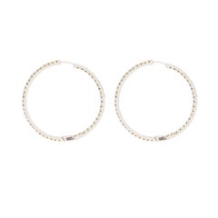 Orecchini a cerchio con diamanti gialli fancy naturali da 1,57 carati, in oro bianco 18 carati