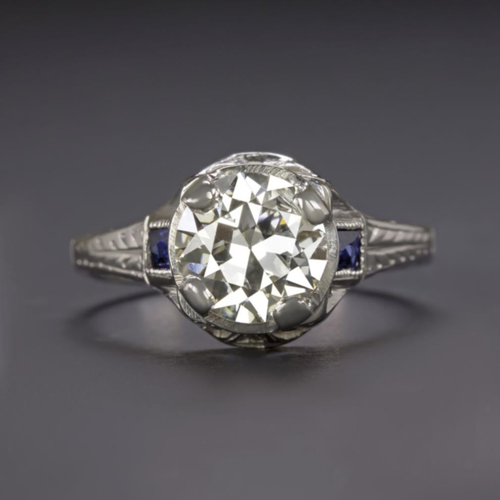 Masterfully detailed and with a significant history, this stunning vintage ring features a substantial 1.57 carat European old cut diamond. Beautifully white and completely clean-eyed, the diamond's wide hand-cut facets dazzle with brilliant