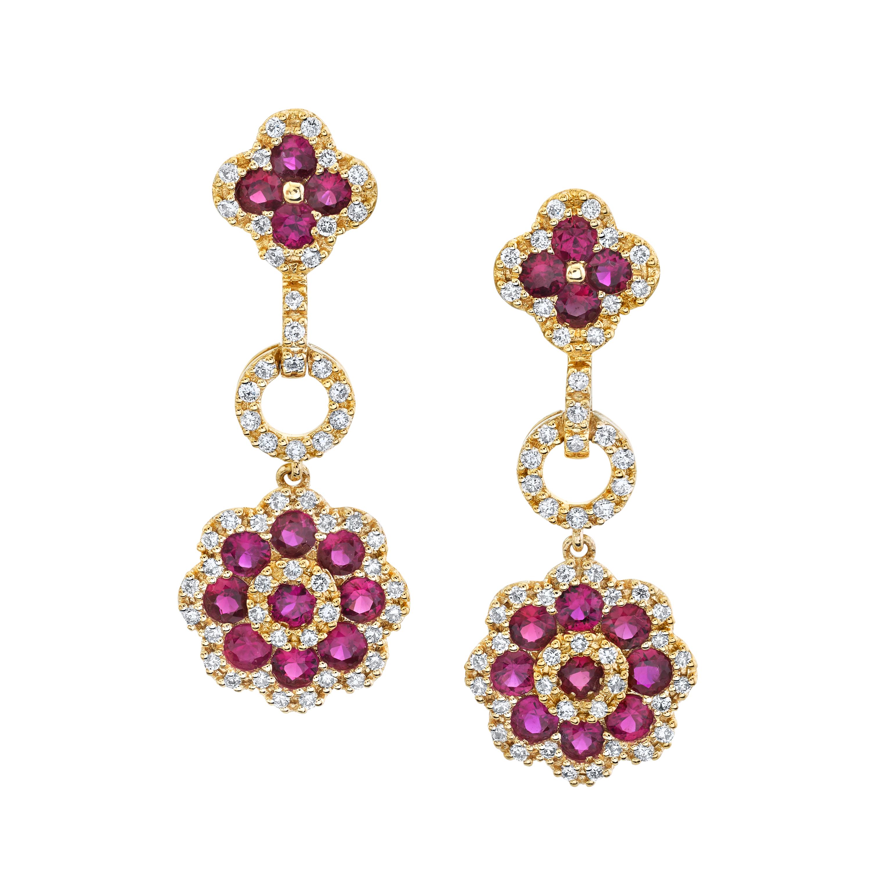 These sparkling drop earrings feature round rubies and diamonds arranged in an elegant yet playful floral pattern and set in 18k yellow gold. The ruby clusters are framed with beautiful diamond borders for eye-catching sparkle and contrast. They are